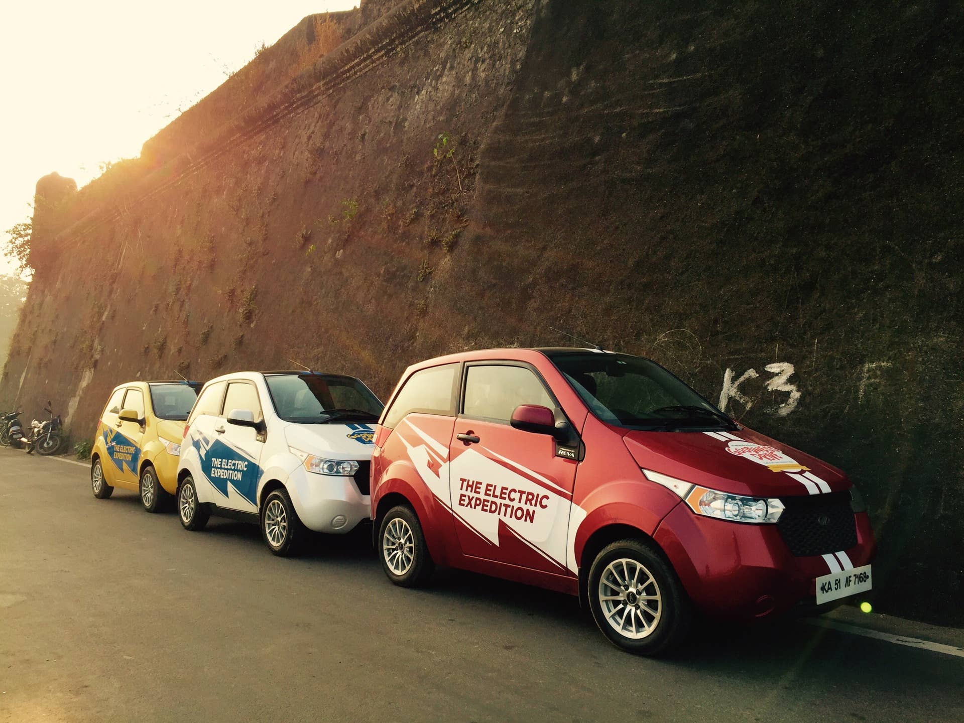 Three REVA EVs lines up during the Mahindra Electric Expedition.
