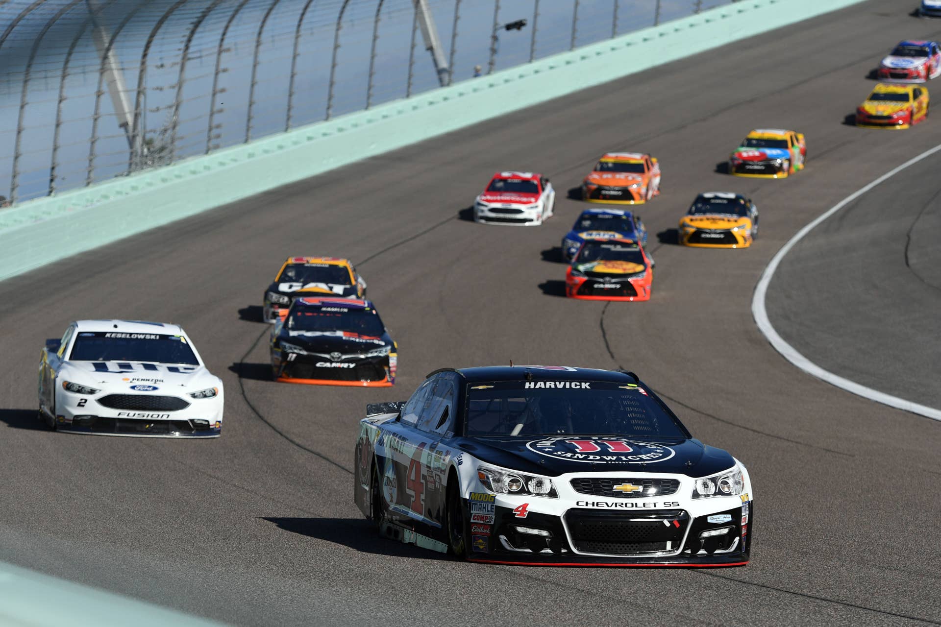 Nov 20, 2016; Homestead, FL, USA; NASCAR Sprint Cup Series driver Kevin Harvick (4) leads the field during the Ford Ecoboost 400 at Homestead-Miami Speedway. Mandatory Credit: Jasen Vinlove-USA TODAY Sports
