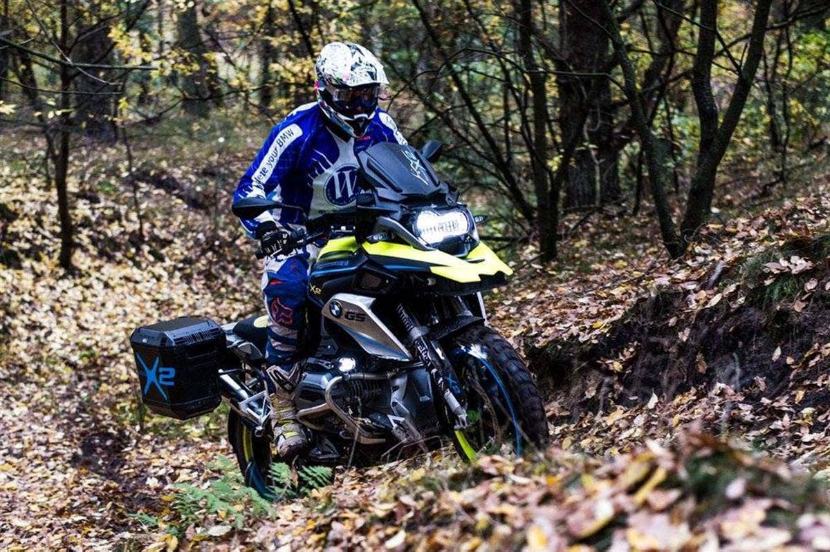 The two-wheel drive Wunderlich BMW R1200 GS LC, which uses a 10kW hub motor up front and a battery pack under the beak, going up a hill.