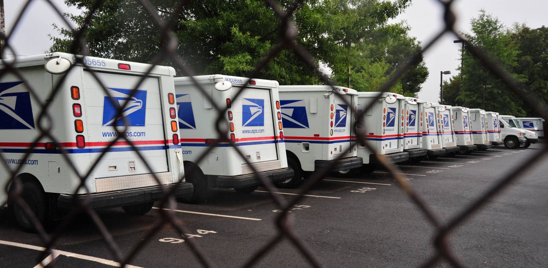 (FILES)US Postal Service mail delivery trucks sit idle at the Manassas Post Office in Virginia on September 5, 2011.The US Postal Service unveiled September 15, 2011 a drastic downsizing scheme for the embattled public company, including cutting 35,000 jobs, as it seeks to avoid collapse amid a 'new reality' in the economy. 'Faced with a massive nationwide infrastructure that is no longer financially sustainable,' the USPS said it was proposing sweeping changes aimed at saving the organization up to $3 billion a year. AFP PHOTO/Karen BLEIER / FILES (Photo credit should read KAREN BLEIER/AFP/Getty Images)