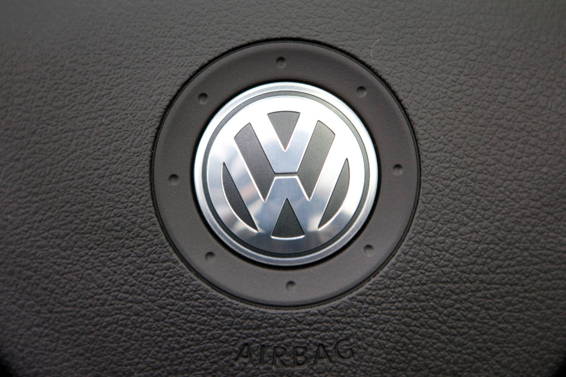CHINA - JULY 13: The Volkswagen AG badge is mounted on a steering wheel of a vehicle at a dealership in Beijing, China, on Monday, July 13, 2009. FAW-Volkswagen Automotive Co., a Chinese venture of Volkswagen AG, aims to boost annual sales to 1 million units, China Business News reported, citing General Manager for Sales Hu Yong. (Photo by Adam Dean/Bloomberg via Getty Images)