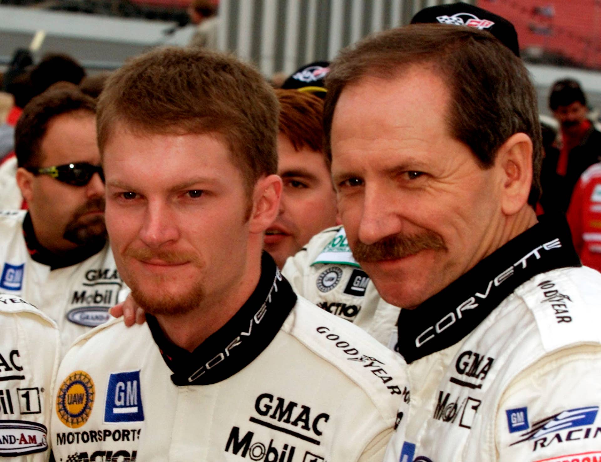 NASCAR drivers Dale Earnhardt (R) and his son, Dale Earnhardt Jr., pose for pictures on pit road moments before the start of the Rolex 24 sports car endurance race at the Daytona International Speedway February 3, 2001 in Daytona Beach, Florida. The NASCAR drivers will share driving duties in the #3 GM Goodwrench Corvette with Andy Pilgrim and Kelly Collins. JLS/SV