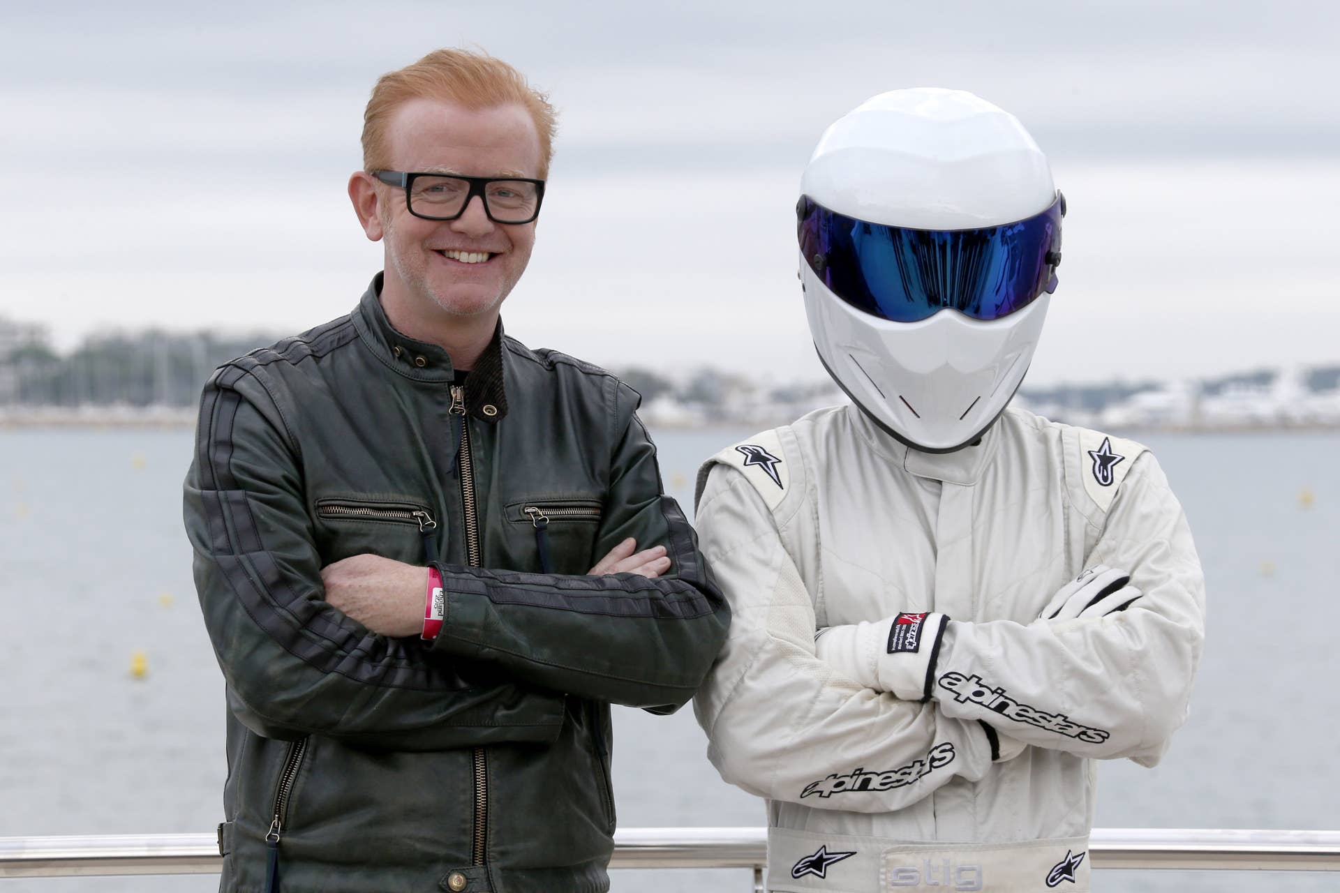 British animator Chris Evans poses next to an anonymous man during a photocall for TV show 'Top Gear' at the MIPCOM audiovisual trade fair in Cannes, southeastern France, on October 6, 2015. Held each year on the French Riviera, the audiovisual trade fair brings together the movers and shakers of the global entertainment business to network, talk shop and buy, sell and finance new content. AFP PHOTO / VALERY HACHE (Photo credit should read VALERY HACHE/AFP/Getty Images)