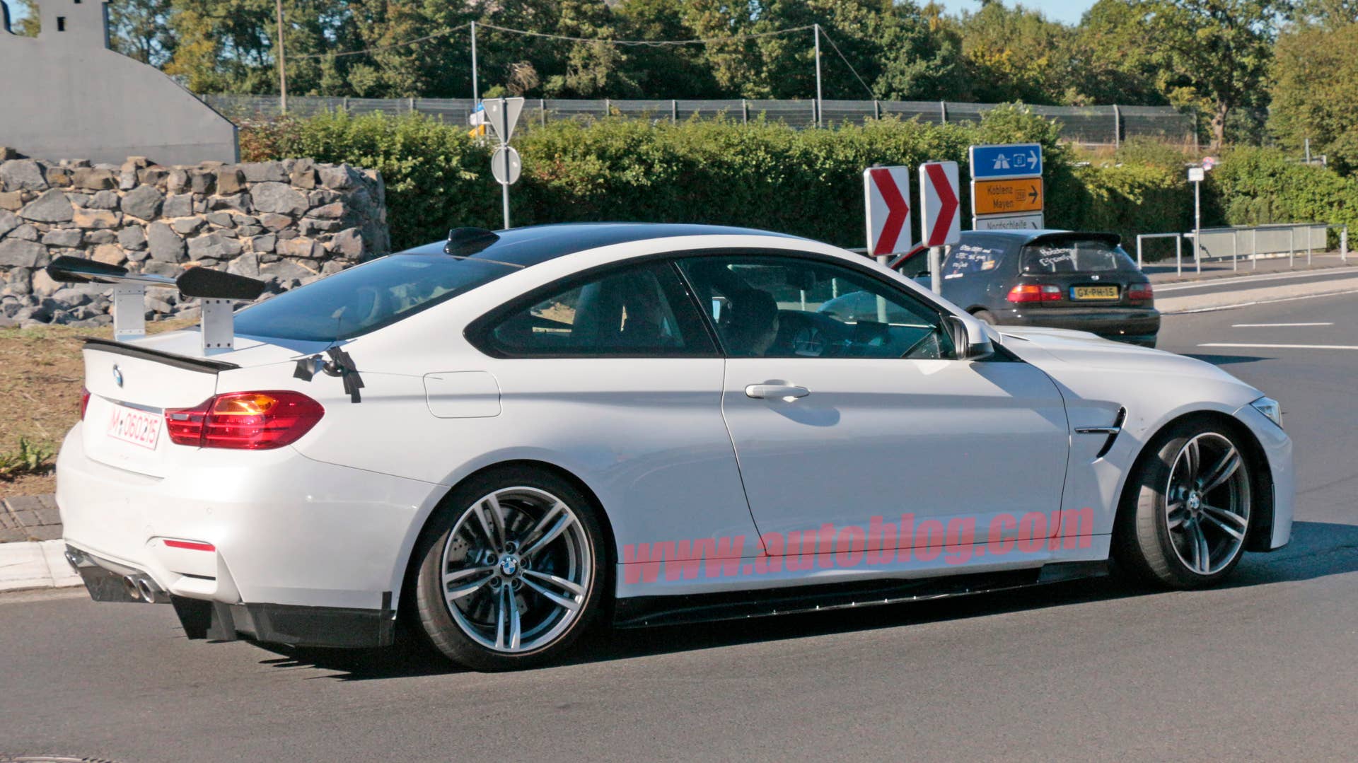 BMW M4 With Extreme Aero Spy Shots Side Rear Exterior