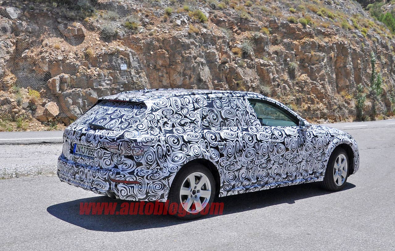 camouflaged audi a4 allroad spy shots rear three quarters