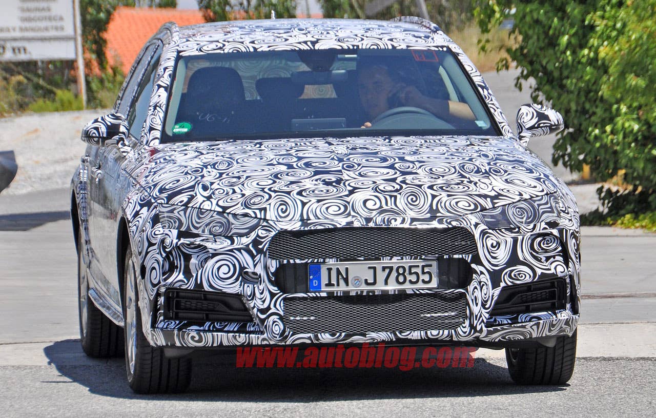 camouflaged audi a4 allroad spy shots front