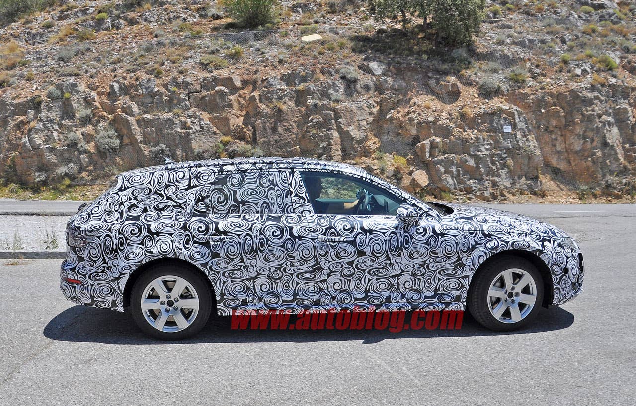 camouflaged audi a4 allroad spy shots side