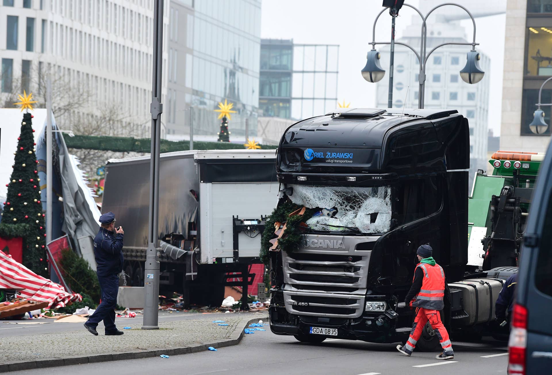 A truck that crashed into a Christmas market near the Kaiser-Wilhelm-Gedaechtniskirche (Kaiser Wilhelm Memorial Church) in Berlin is pictured on December 20, 2016. German police said they were treating as 'a probable terrorist attack' the killing of 12 people when the speeding lorry cut a bloody swath through the packed Berlin Christmas market. / AFP / Tobias SCHWARZ (Photo credit should read TOBIAS SCHWARZ/AFP/Getty Images)