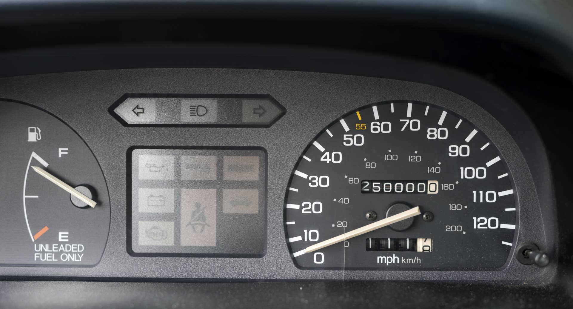 Odometer reading 250,000 miles and a fuel gauge nearly full, ready for more driving.