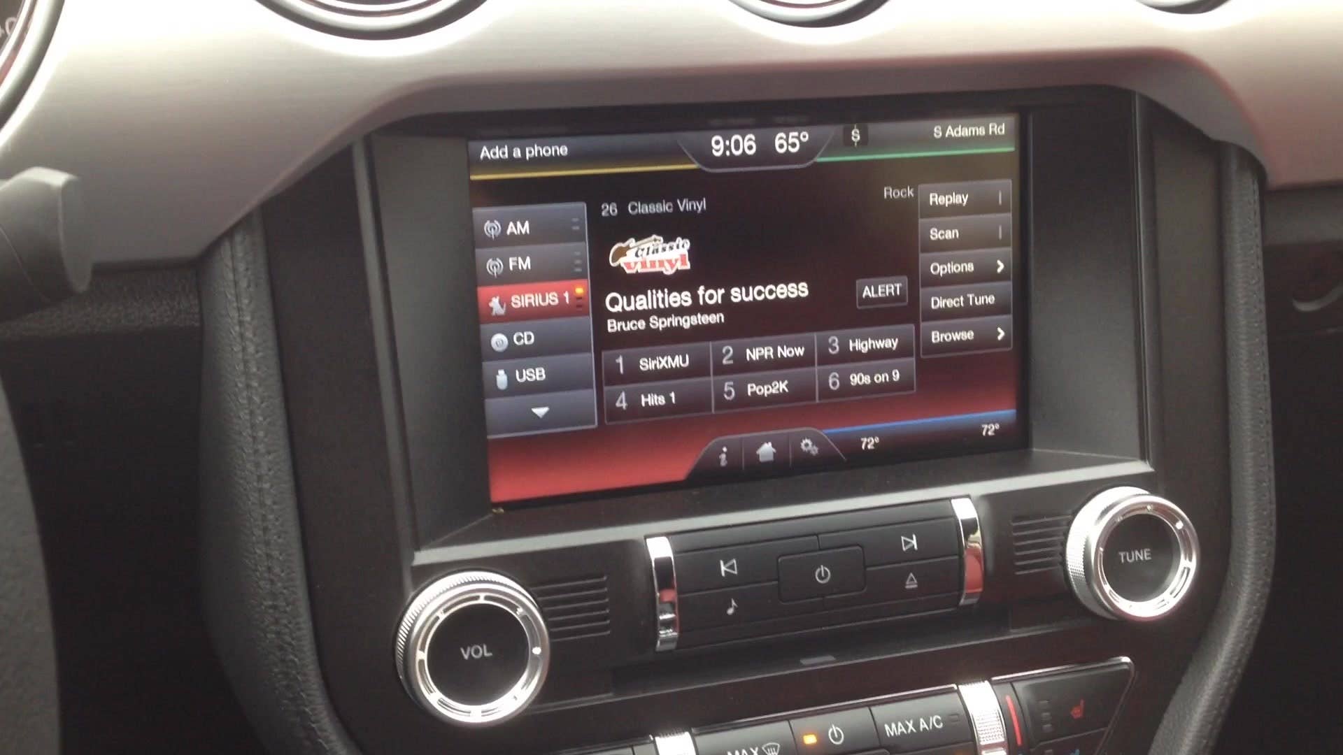 Greg Migliore illustrates the interior features of the 2015 Ford Mustang convertible.
