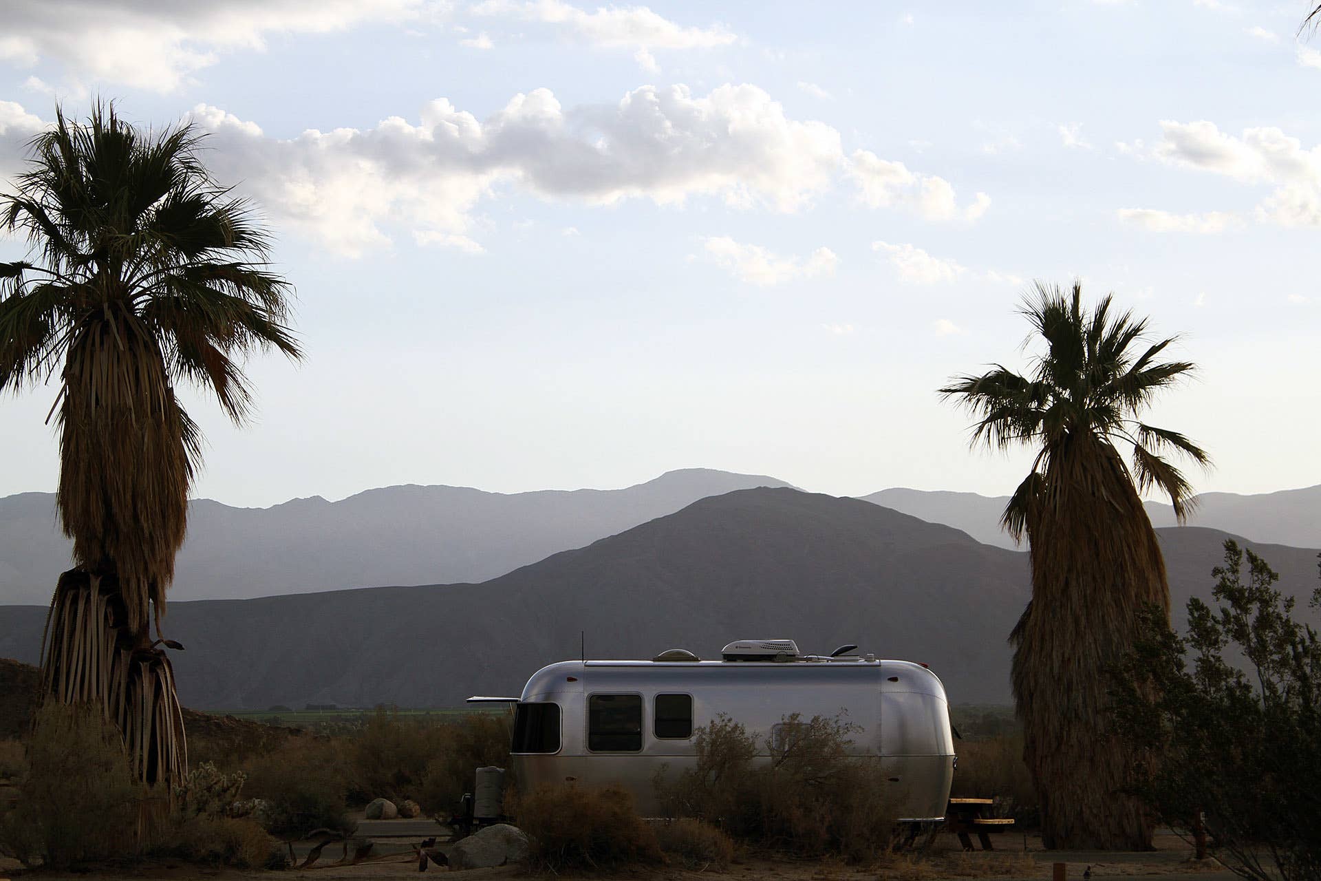 Airstream Bambi Sport 22 side mountains palm trees