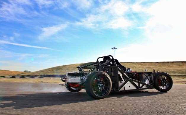 Erik Hansen slides his electric Factory Five 818 around the track