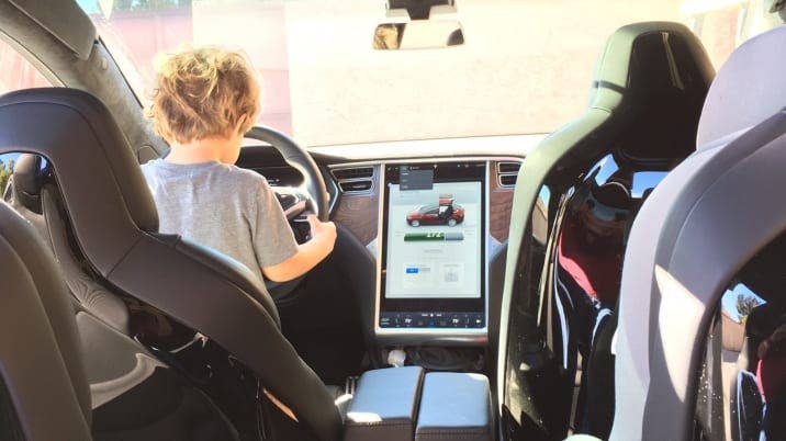 Kid in a Tesla Model X