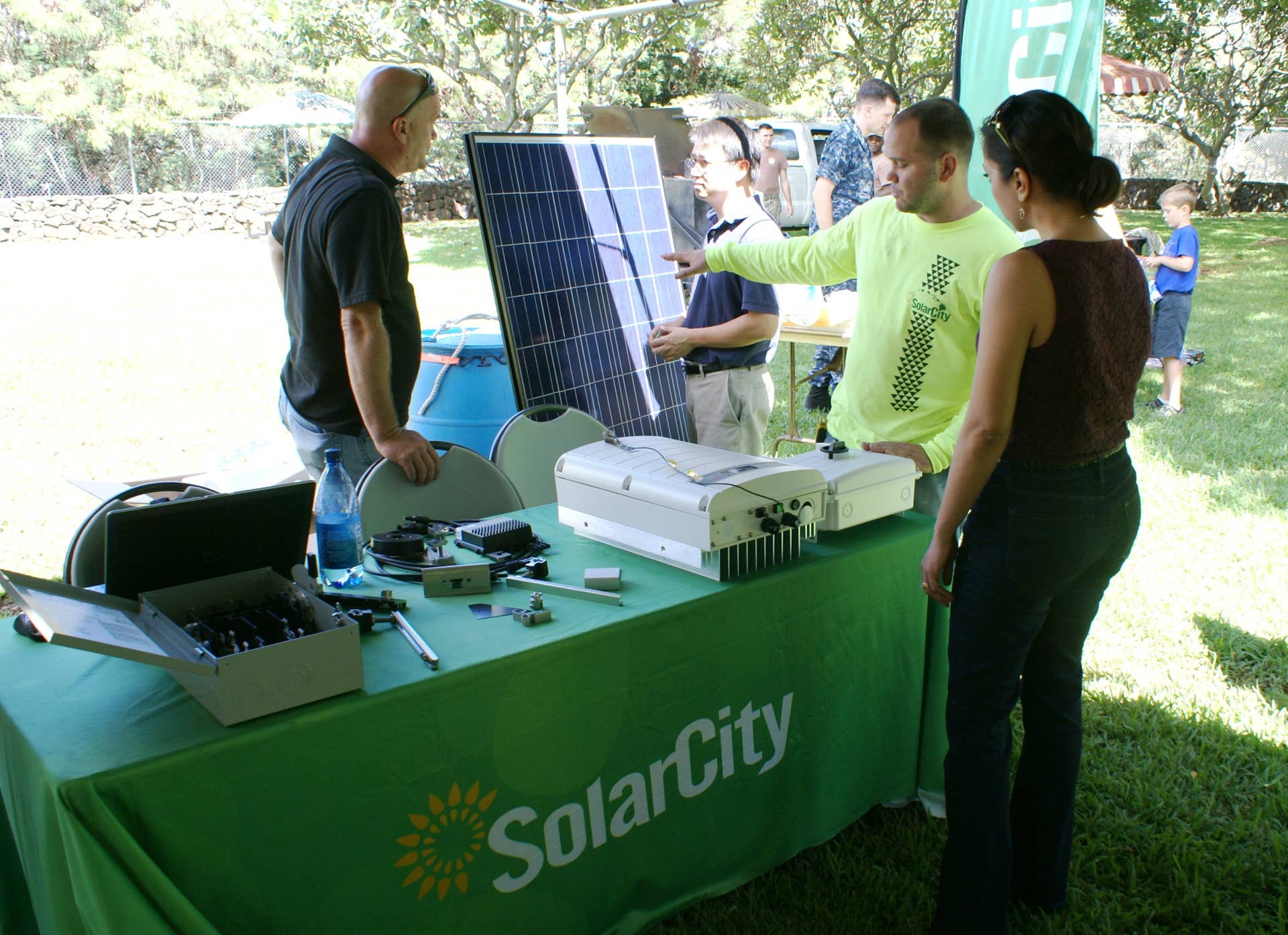 Industry Partner SolarCity attended the NAVFAC Pacific Energy Action day Fair held Oct. 23 at the Makalapa Compound. Company representatives explained the purpose of photovoltaic panels and the type of equipment needed to ensure its proper use for energy savings. (Photo by Krista K. Catian, NAVFAC Pacific Public Affairs)