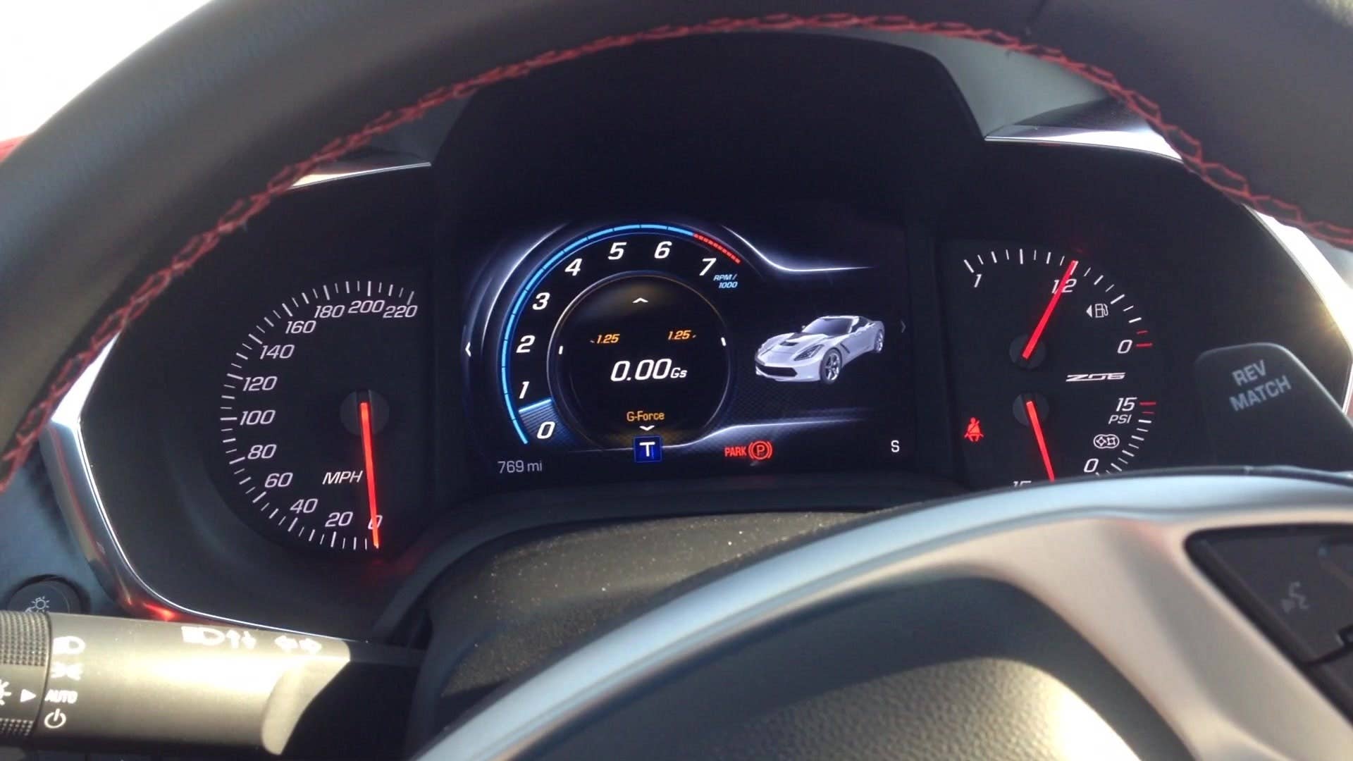 Senior editor Greg Migliore shows off the interior of the 2015 Chevrolet Corvette Z06.