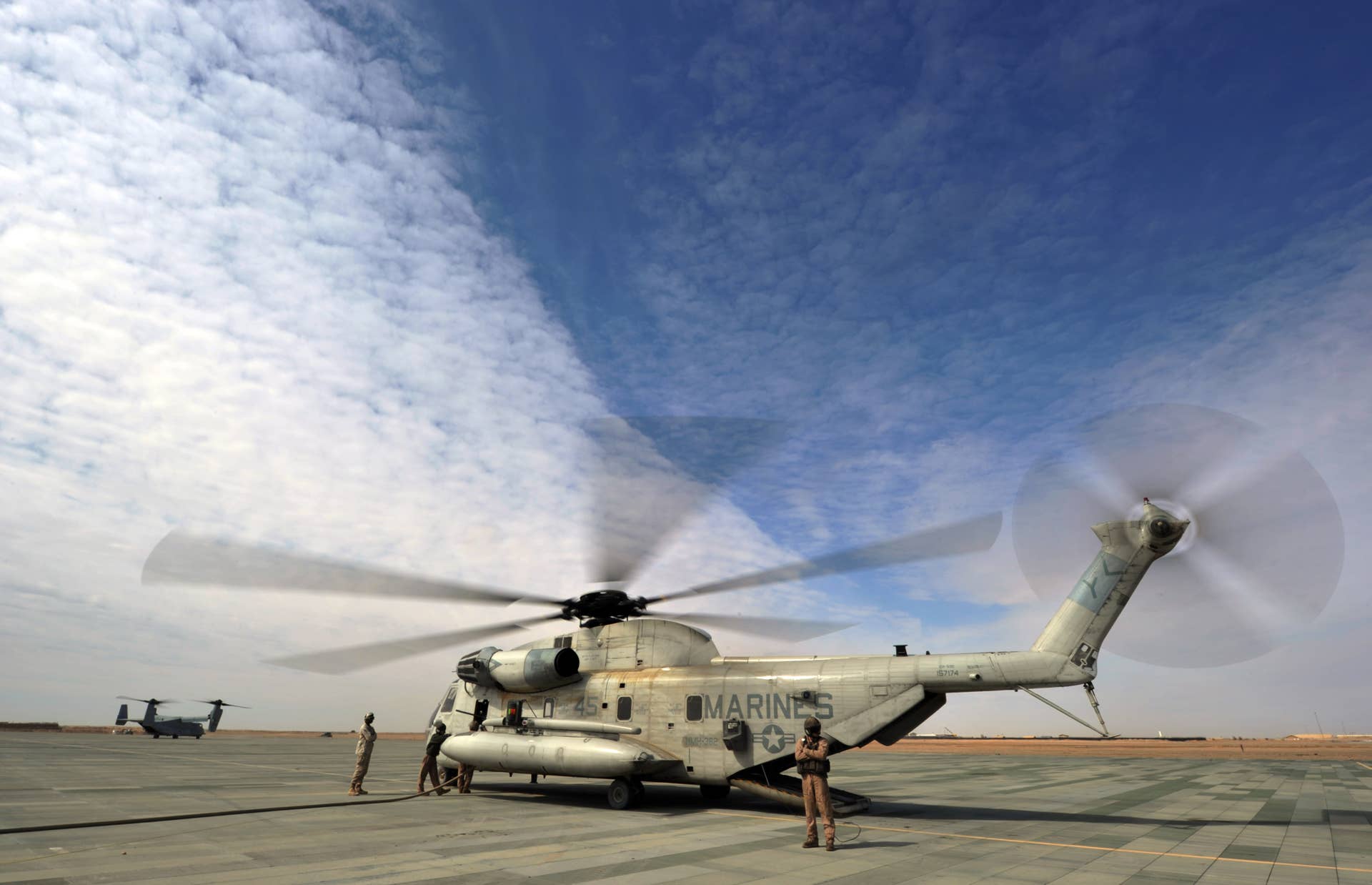 US Marines refuel a CH-53 helicopter at camp Dwyer, Gamser in Helmand Province on February 16, 2011. There are around 140,000 foreign troops in Afghanistan fighting the Taliban, who were ousted from power by a US-led invasion in 2001 following the September 11 attacks. AFP PHOTO / ADEK BERRY (Photo credit should read ADEK BERRY/AFP/Getty Images)