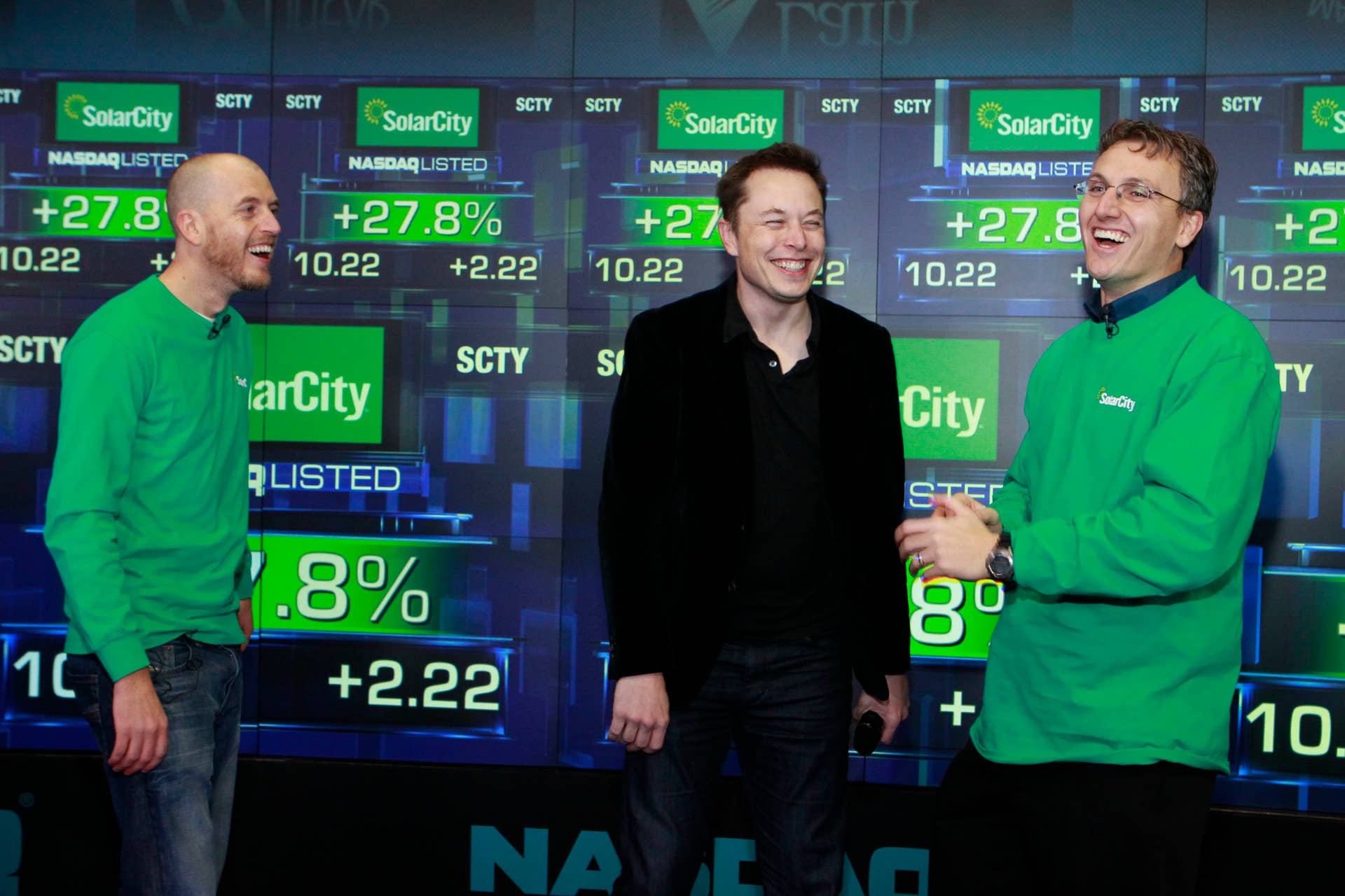 IMAGE DISTRIBUTED FOR SOLARCITY - SolarCity Founder & COO Peter Rive, Chairman Elon Musk, SolarCity Founder & CEO Lyndon Rive celebrate the companys IPO at the NASDAQ Stock Market on Thursday, Dec. 13, 2012 in New York. SolarCity is a leader of distributed clean energy and will trade under SCTY. (Mark Von Holden/AP Images for SolarCity)