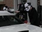 Watch a pair of Stormtroopers drive a car that looks like their helmet to the gas station. They're people just like us.