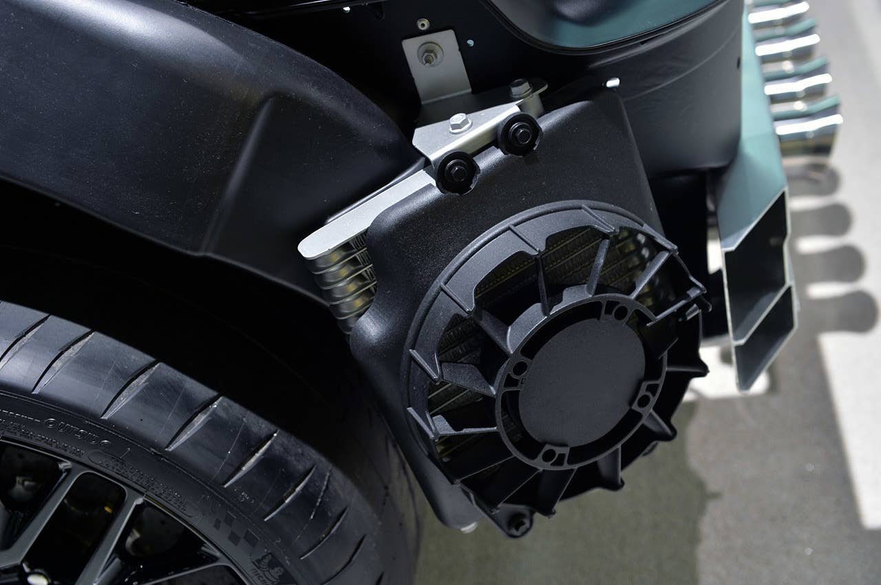 Intakes over each rear wheel feed cool air to radiators located in the rear quarter panels to help lower transmission and differential temperatures. Electric fans, pulling air through the core, boost airflow.