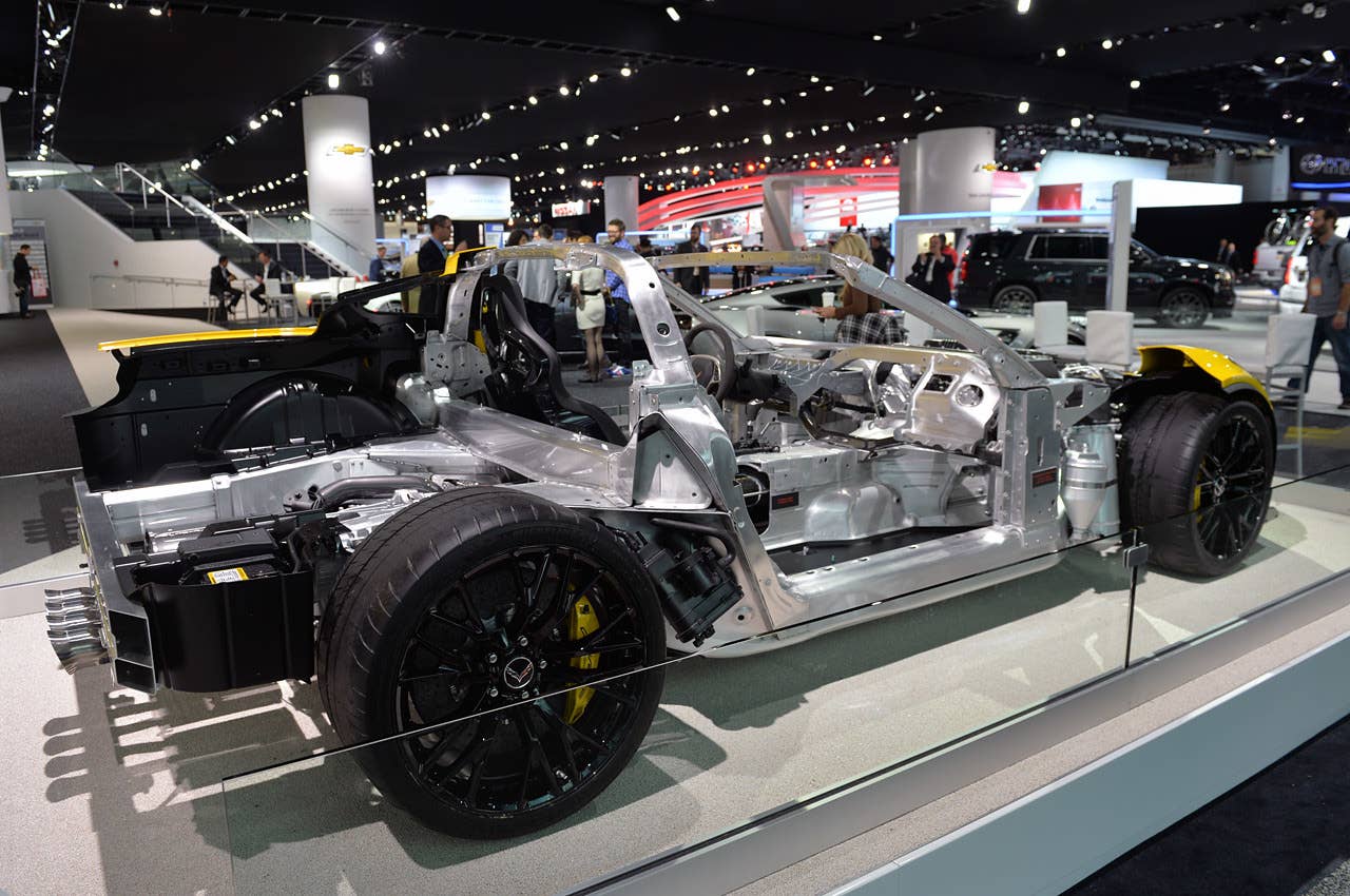 Stripped of nearly all of its composite body panels, the chassis of the Z06 is nearly entirely constructed of aluminum alloy. Note that the integrated aluminum roll hoop and windshield surround, comprising the passenger safety cage, are completely constructed of lightweight aluminum.