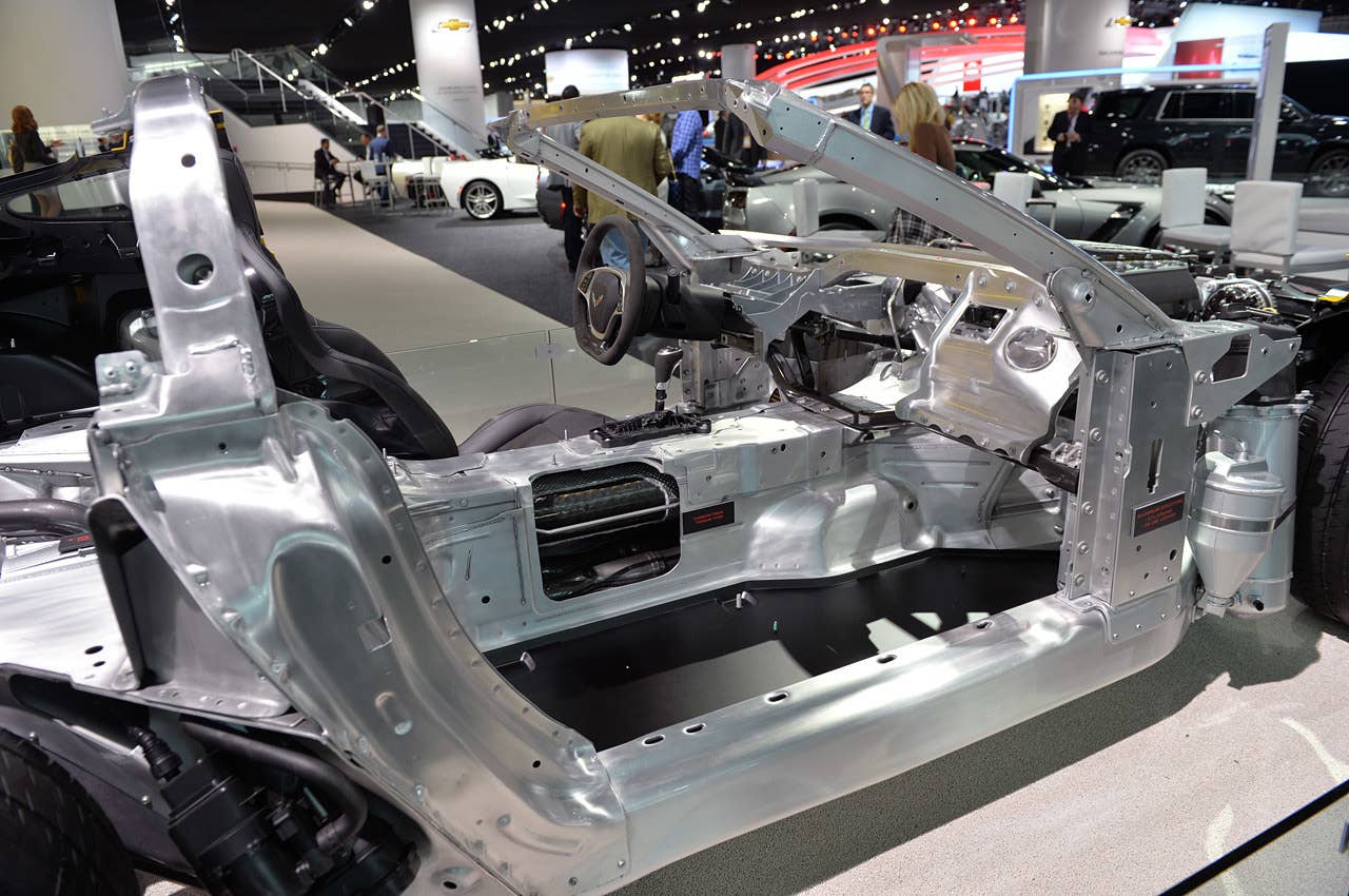 Nearly everything in the image is shiny aluminum — but it's not that simple, as Chevrolet is using a variety of alloys depending on the strength and weight requirements. Most everything in this image is extruded, hydroformed or sheet that has been bent at specific angles. Note the entire windshield surround is aluminum!