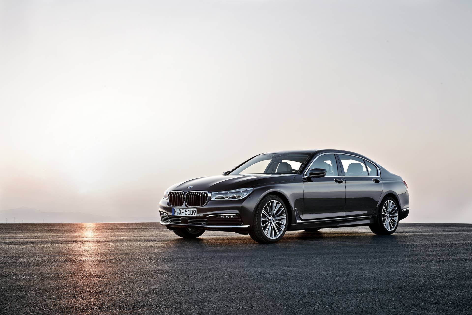7 series bmw sunset front quarter
