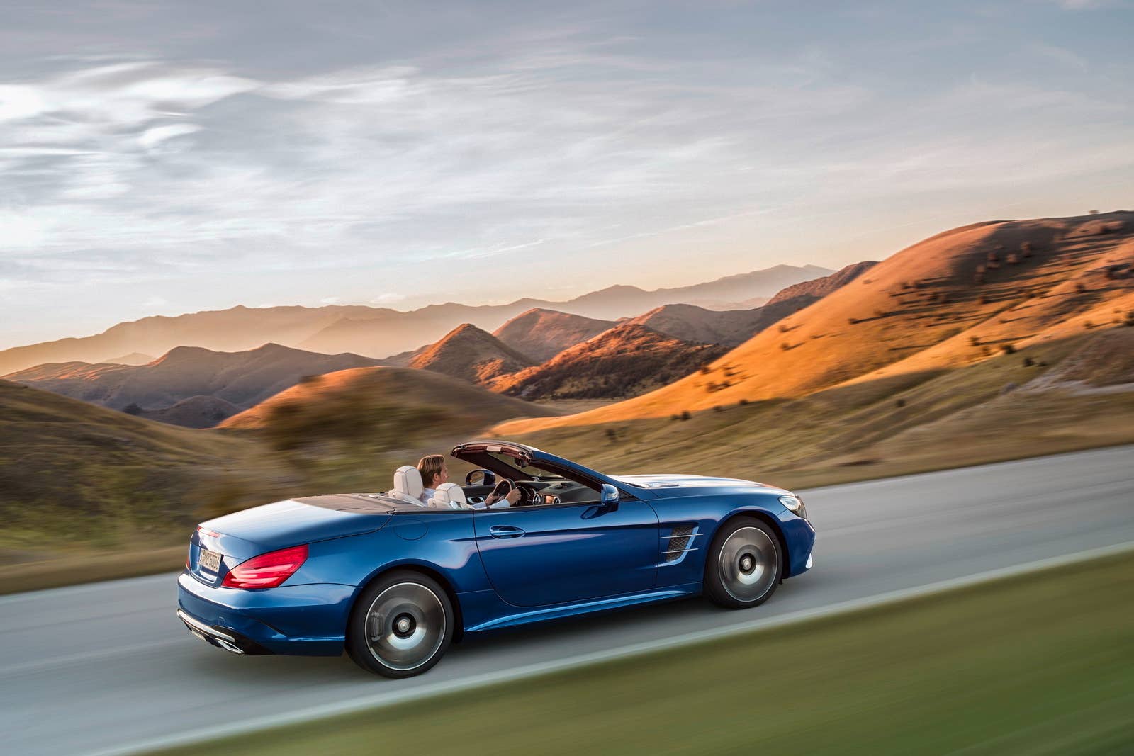 blue 2017 mercedes sl rear mountains