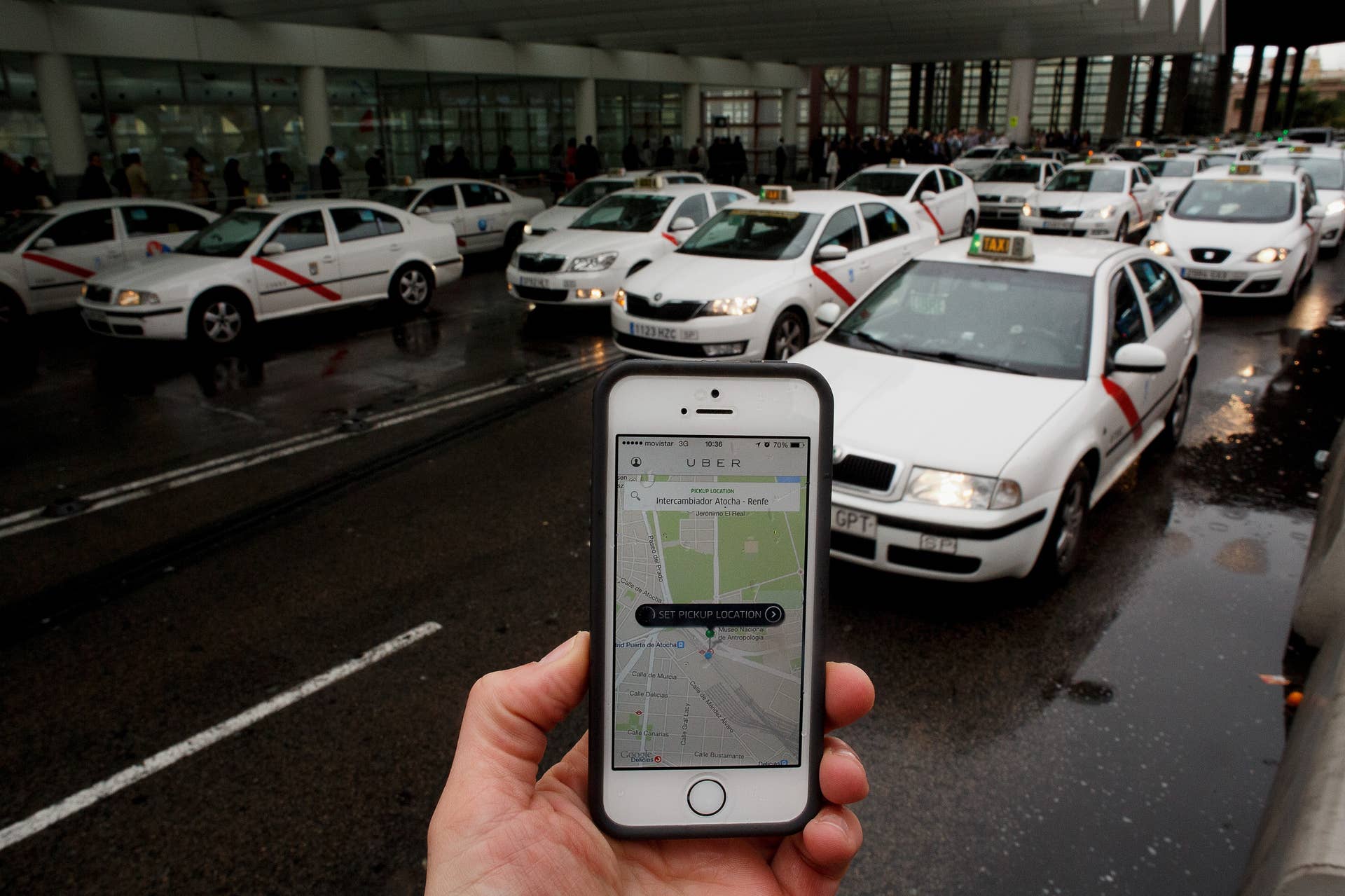 MADRID, SPAIN - OCTOBER 14:  In this photo illustration the new smart phone taxi app 'Uber' shows how to select a pick up location at Atocha Station on October 14, 2014 in Madrid, Spain. 'Uber' application started to operate in Madrid last September despite Taxi drivers claim it is an illegal activity and its drivers currently operate without a license. 'Uber' is an American based company which is quickly expanding to some of the main cities from around the world.  (Photo by Pablo Blazquez Dominguez/Getty Images)
