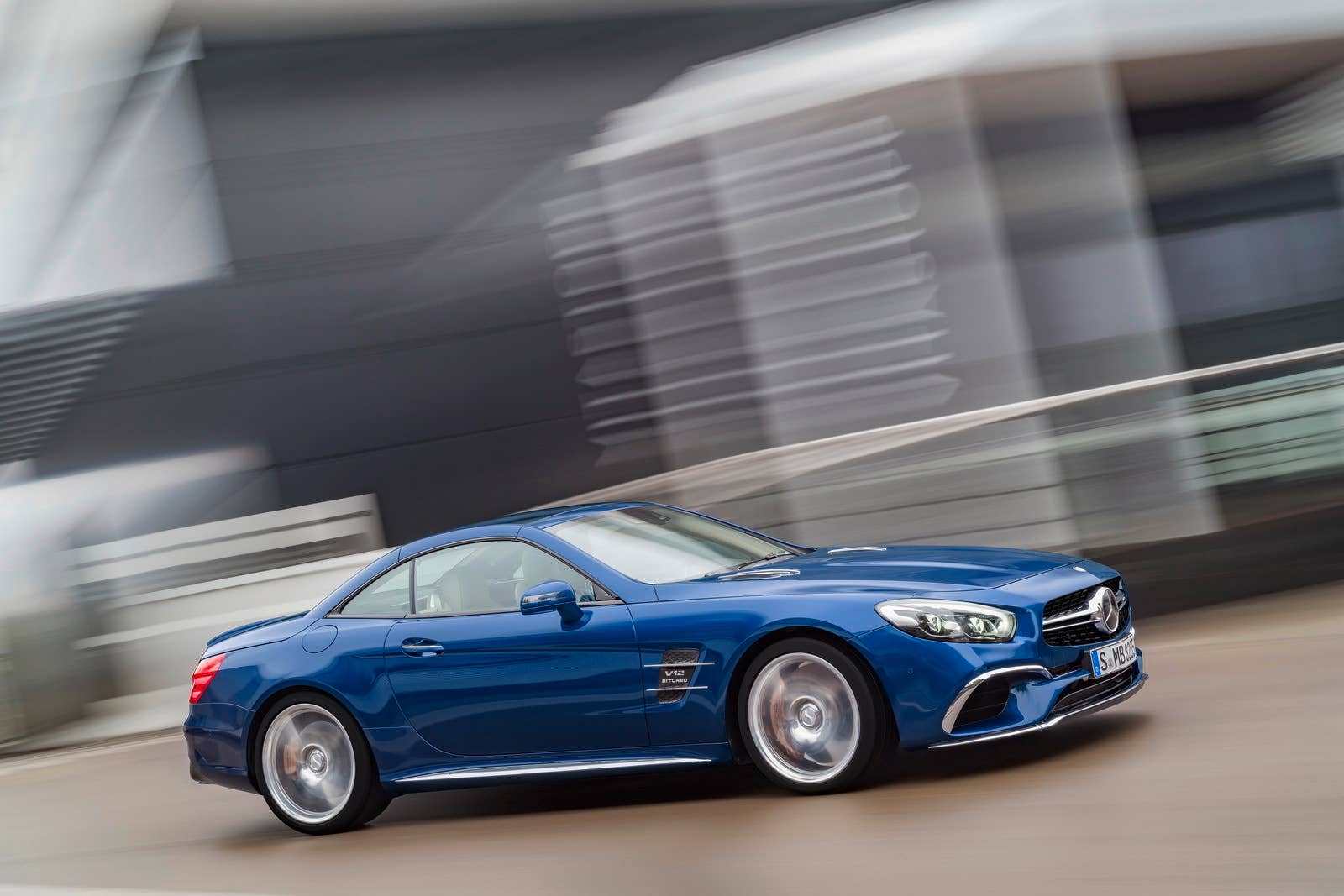 blue 2017 mercedes sl top up road