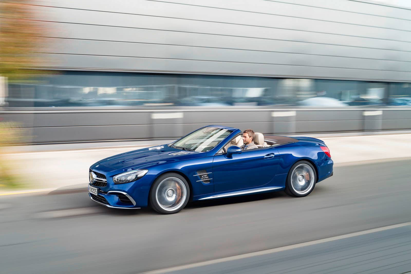 blue 2017 mercedes sl side road