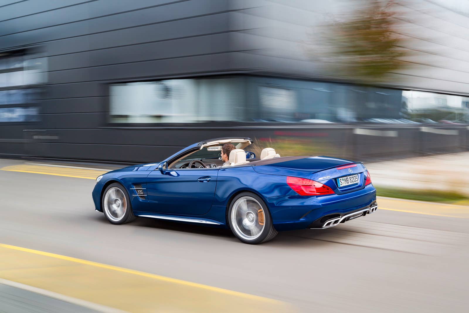 blue 2017 mercedes sl rear three quarters road