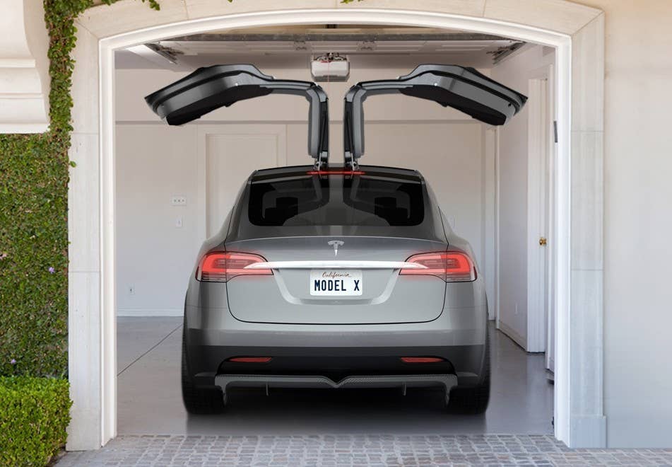 tesla model x falcon wing doors in garage