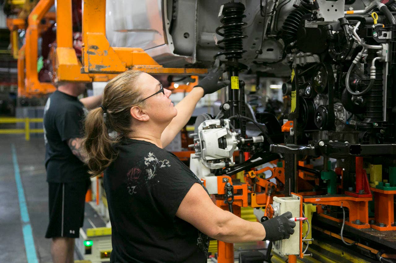 Stacey Myers, member of UAW Local 5960, working on the assembly line at the General Motors Orion plant Monday, June 22, 2015 in Orion Township, Michigan. General Motors announced today it will invest $245 million in the plant to support the launch of a vehicle program unlike any in Orion Assembly's 32-year history. Investment in Orion totals $962 million since the UAW and GM worked together to reopen the previously idled plant in 2010. (Photo by Jeffrey Sauger for General Motors)