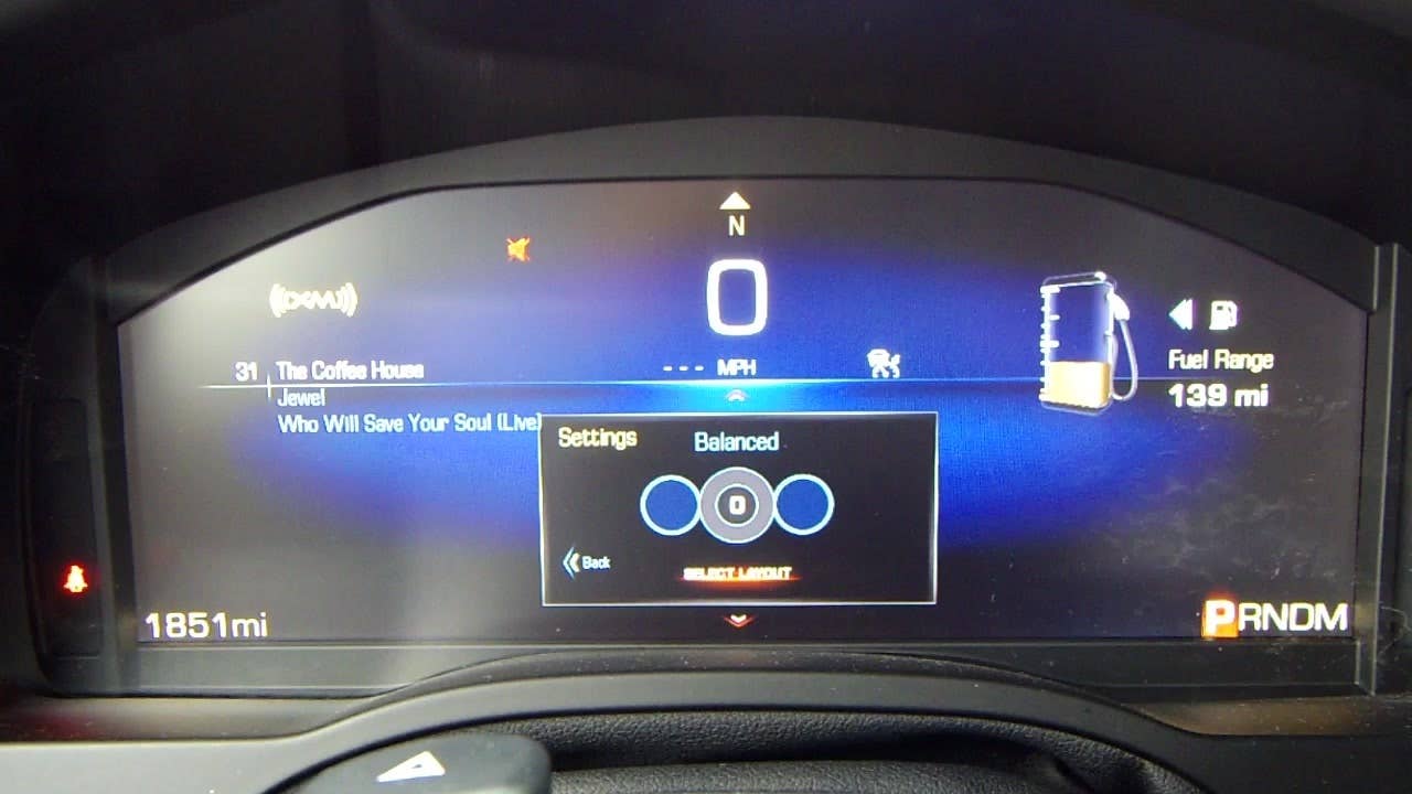 Autoblog's Jeremy Korzeniewski demonstrates the different modes of the 2015 Cadillac Escalade's digital dash cluster.