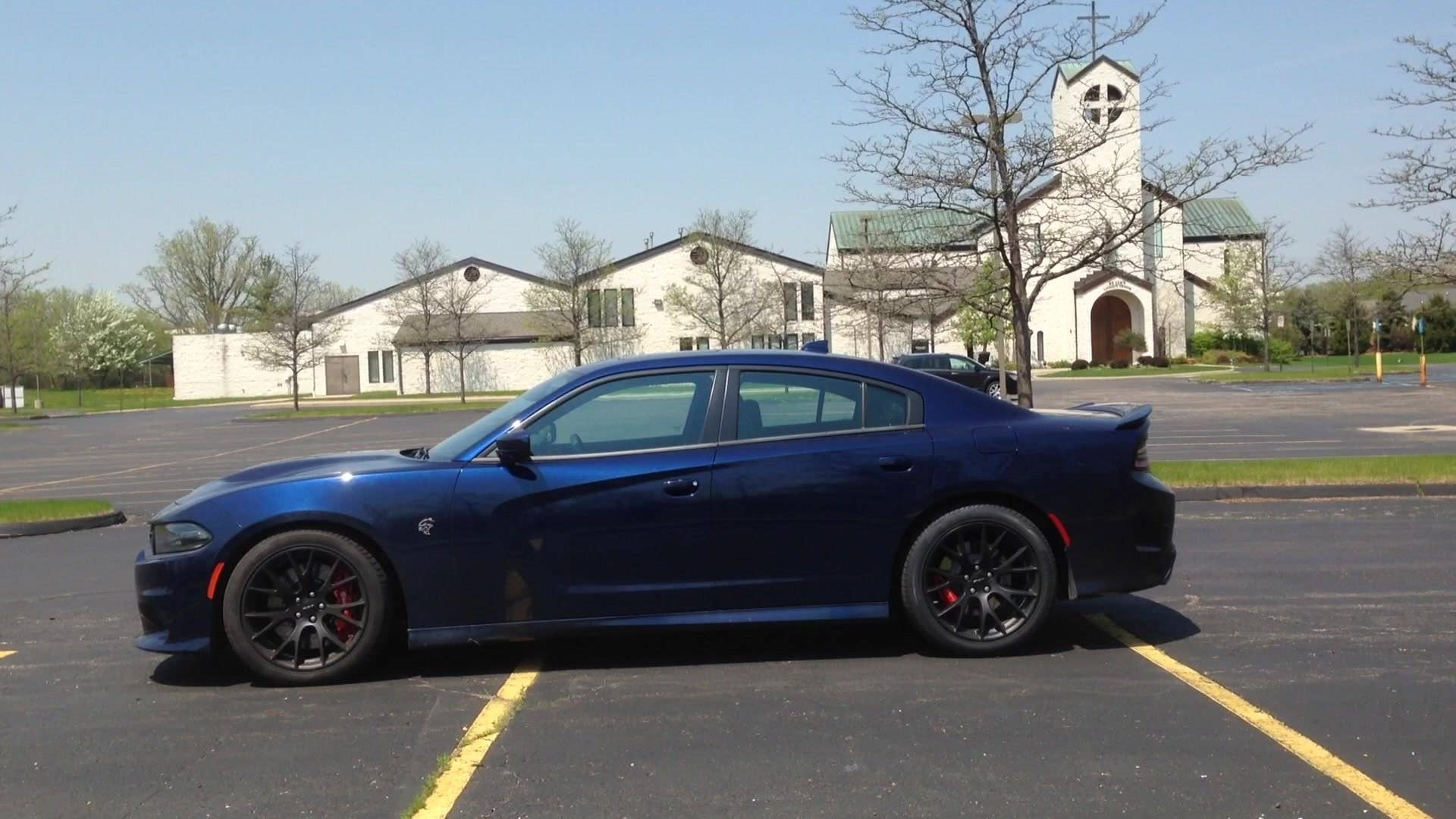 Senior editor Greg Migliore cues up the 707 horses of the 2015 Dodge Charger SRT Hellcat with the push of a button.