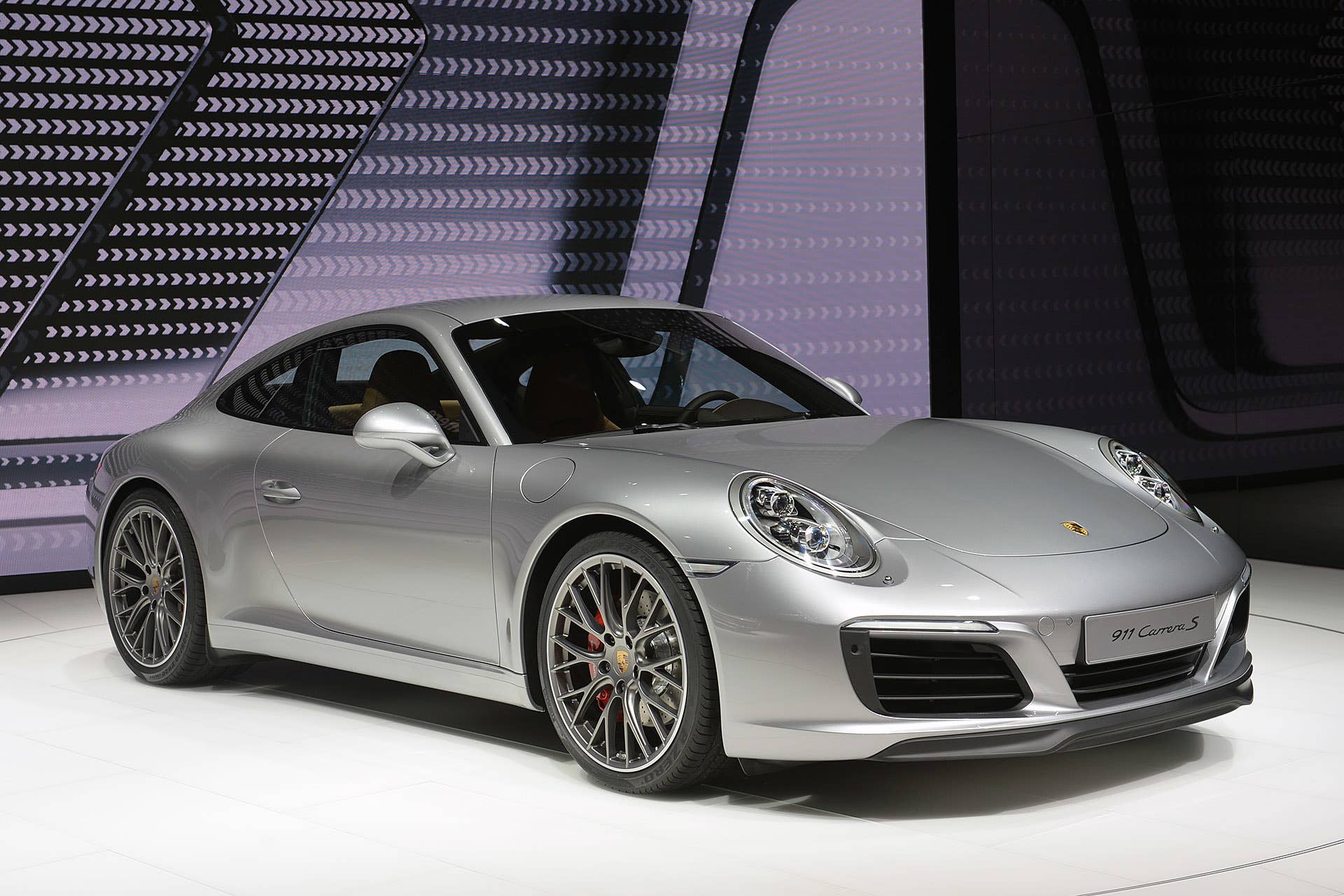 The 2016 Porsche 911 Carrera, now with a turbocharged engine in the standard car, unveiled at the Frankfurt Motor Show, front three-quarter view.