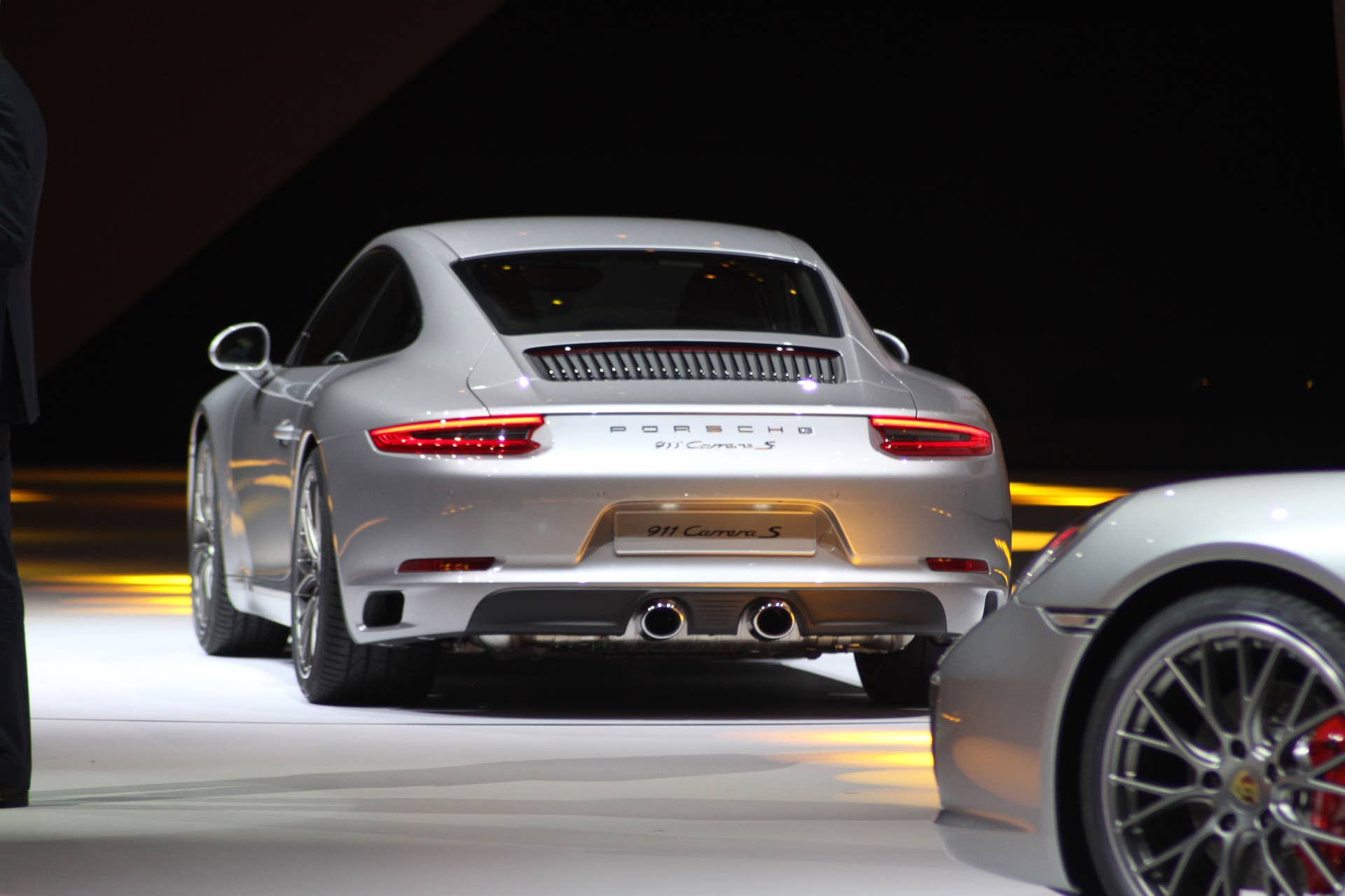 The 2016 Porsche 911 Carrera S, now with a turbocharged engine in the standard car, unveiled at Volkswagen's Group Night ahead of the 2015 Frankfurt Motor Show, rear.