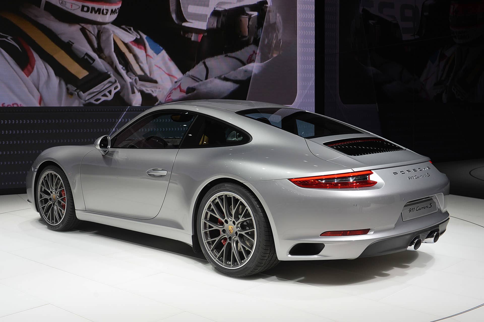 The 2016 Porsche 911 Carrera, now with a turbocharged engine in the standard car, unveiled at the Frankfurt Motor Show, rear three-quarter view.