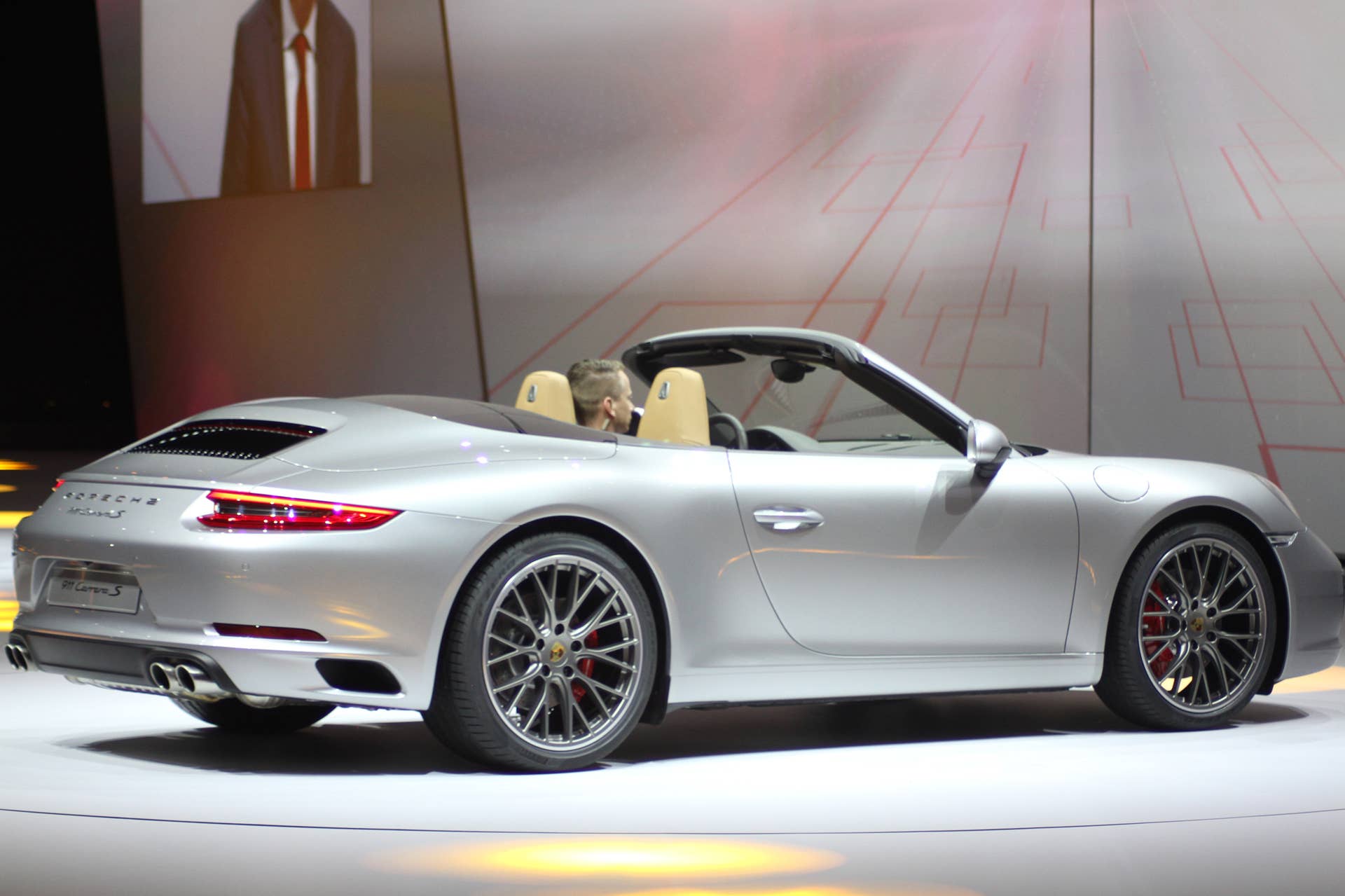 The 2016 Porsche 911 Carrera S Cabriolet, now with a turbocharged engine in the standard car, unveiled at Volkswagen's Group Night ahead of the 2015 Frankfurt Motor Show, rear three-quarter view.