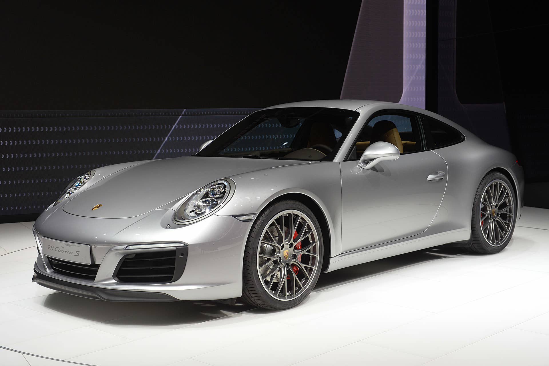 The 2016 Porsche 911 Carrera, now with a turbocharged engine in the standard car, unveiled at the Frankfurt Motor Show, front three-quarter view.