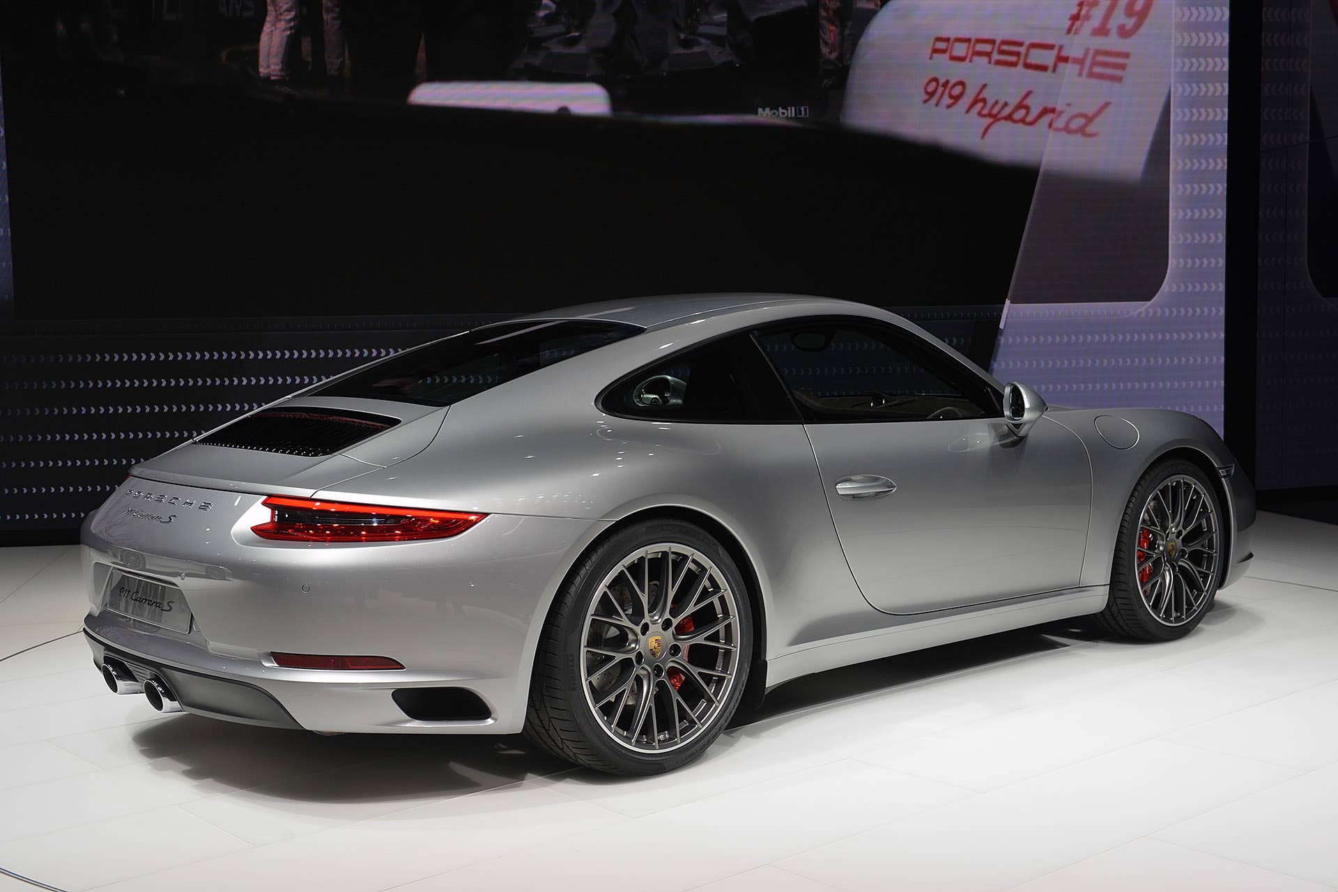 The 2016 Porsche 911 Carrera, now with a turbocharged engine in the standard car, unveiled at the Frankfurt Motor Show, rear three-quarter view.