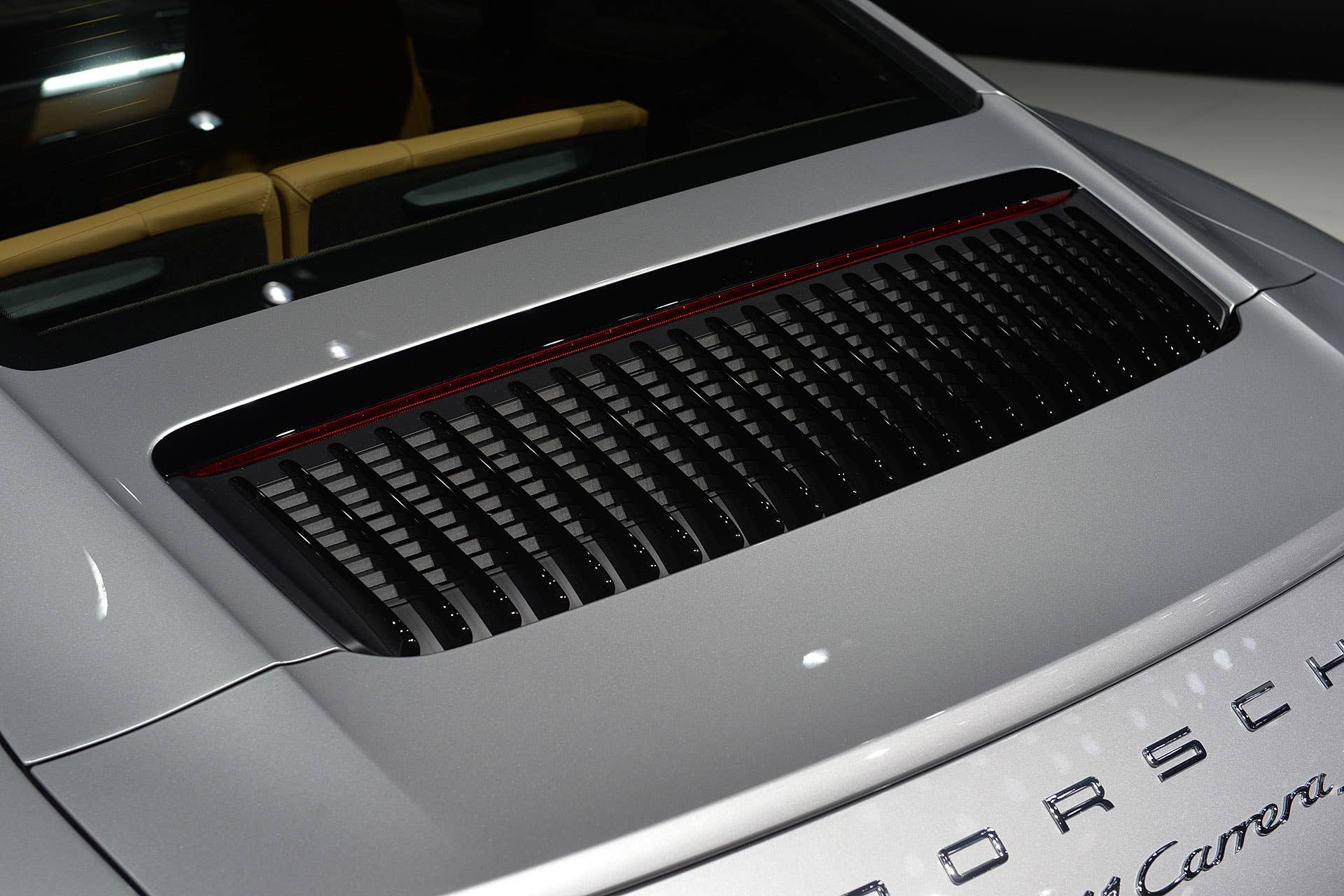 The 2016 Porsche 911 Carrera, now with a turbocharged engine in the standard car, unveiled at the Frankfurt Motor Show, rear spoiler detail.