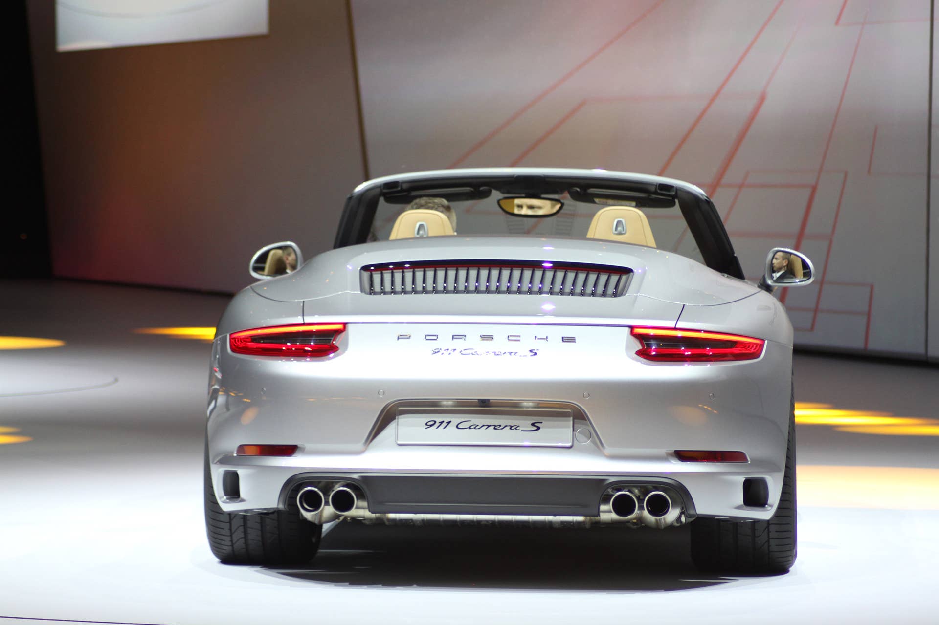 The 2016 Porsche 911 Carrera S Cabriolet, now with a turbocharged engine in the standard car, unveiled at Volkswagen's Group Night ahead of the 2015 Frankfurt Motor Show, rear view.