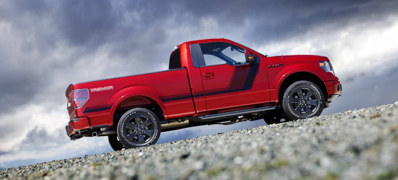 2014 Ford F-150 Tremor: Tremor signals its sport truck capabilities with an appearance package that borrows the stealthy, flat-black accents, with a unique 20-inch flat-black wheel, a stylized bodyside graphic and black badges with red lettering from the FX Appearance Package. (06/27/2013)