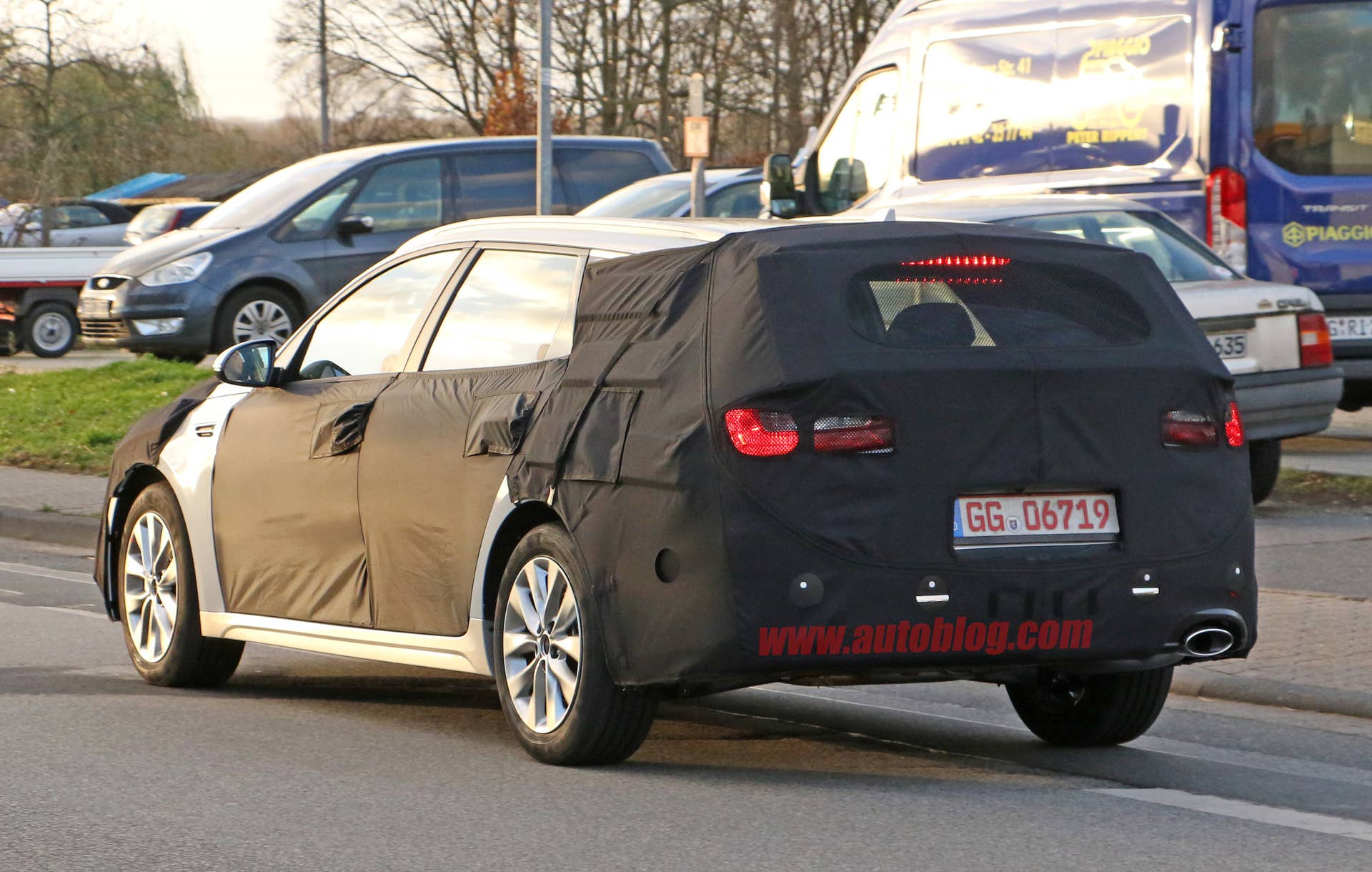 Kia Sportswagon prototype caught by spy photographers, rear three-quarter showing tailpipe.
