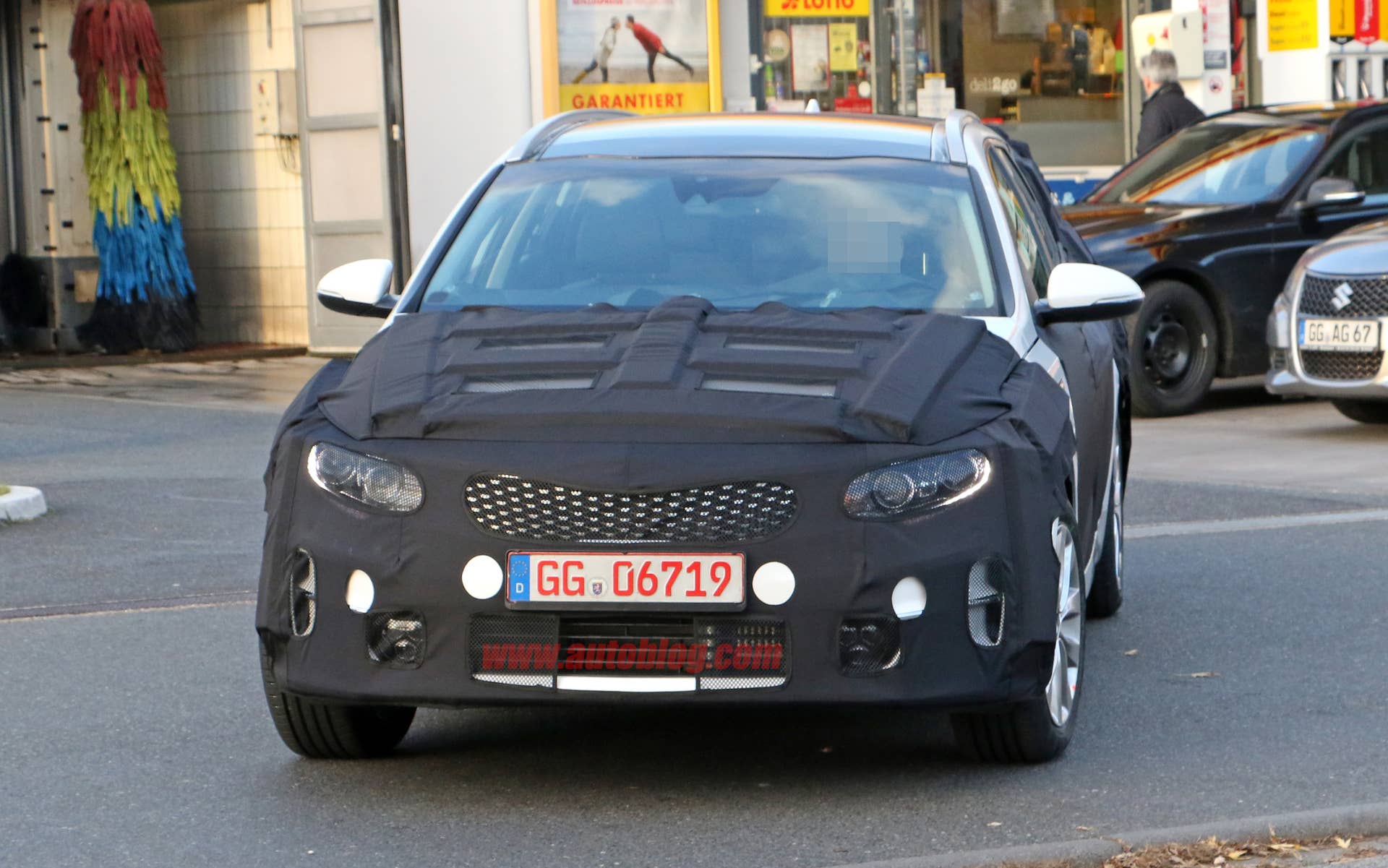 Kia Sportswagon prototype caught by spy photographers, front fascia under wraps.