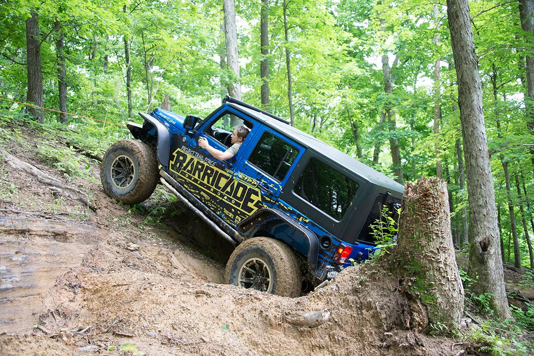 Project Trail Force 2015 Jeep Wrangler Rubicon getting up a hill.