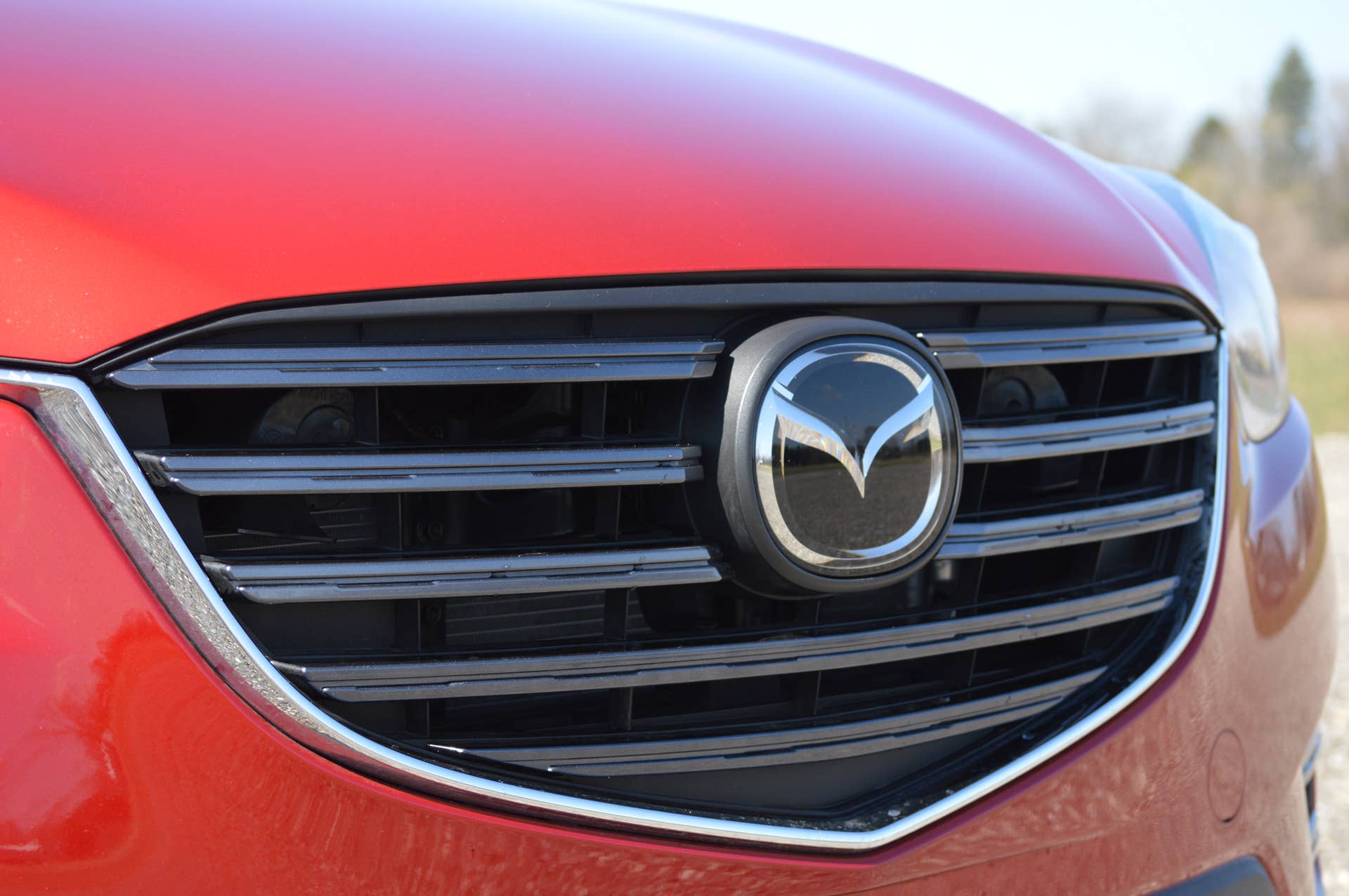 2016 Mazda CX-5 soul red grille detail badge