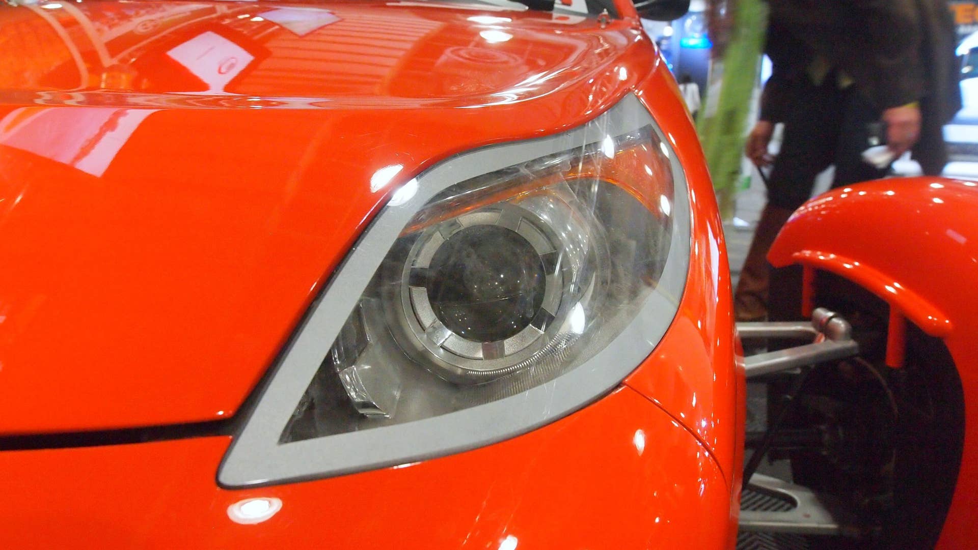 Elio Motors orange trike front headlight