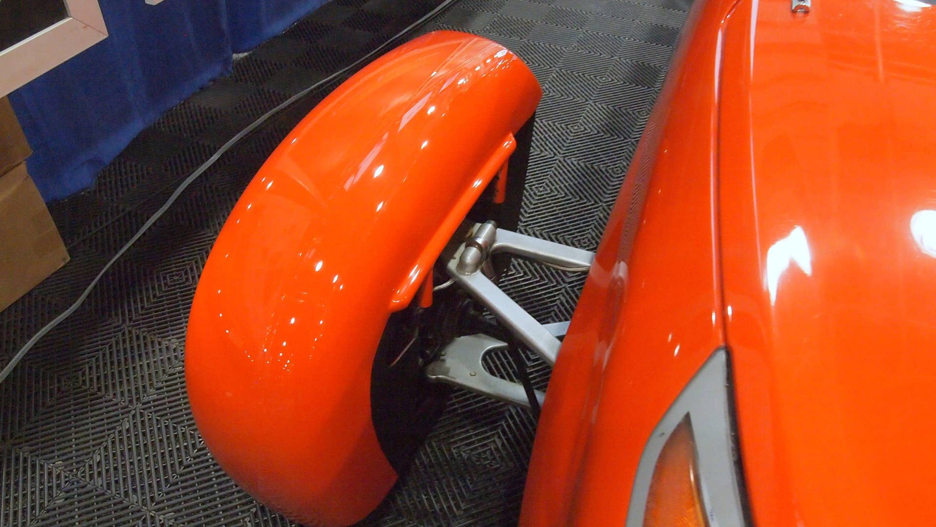Elio Motors orange trike front wheel cover